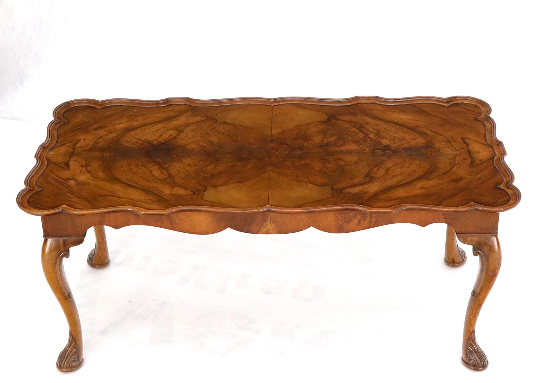 Vintage dramatic vivid walnut grain compact coffee table with scallop shape raised edges.