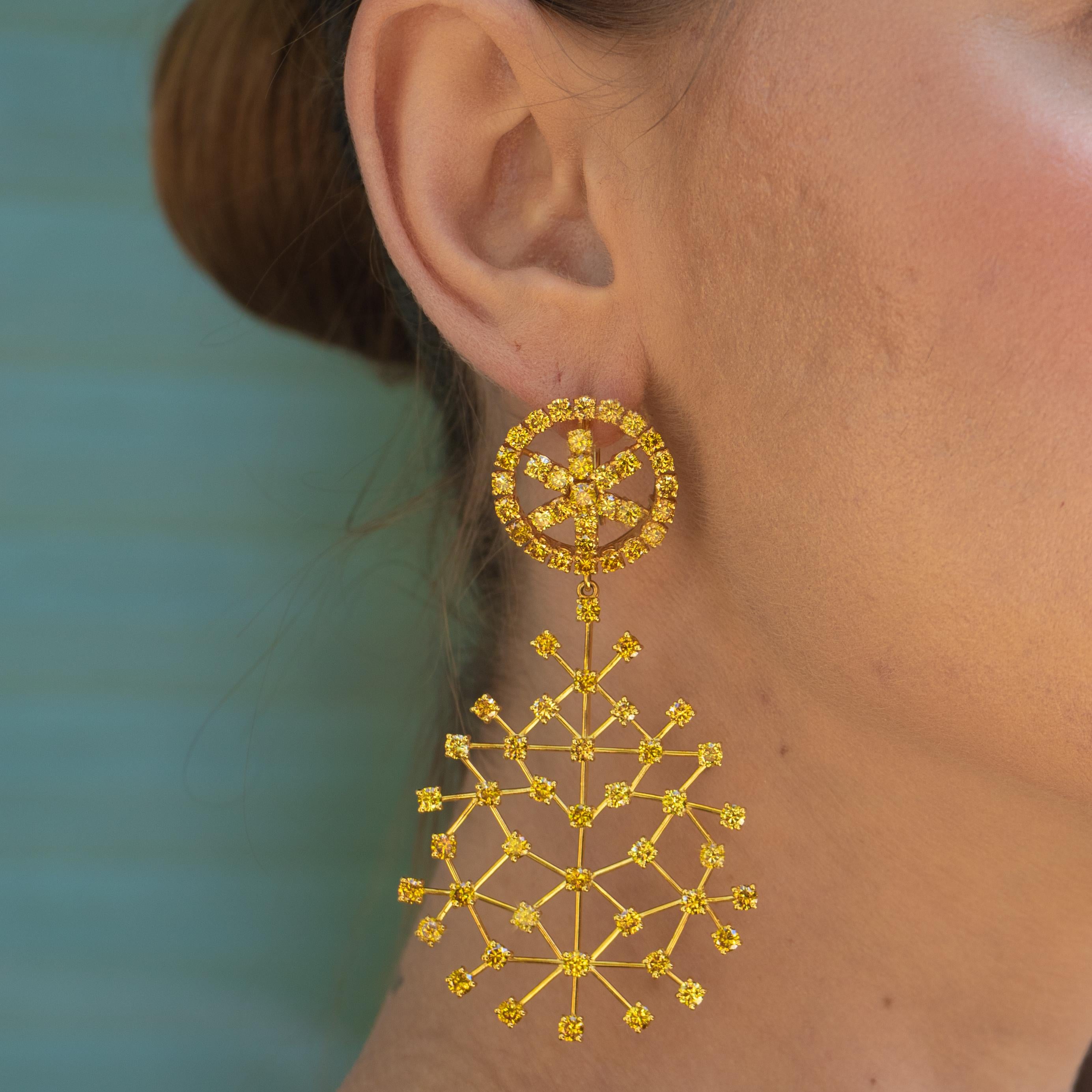 These beautiful canary diamond earrings have some of the most vivid yellow diamonds I've ever seen. These earrings will add a gorgeous flash of color to any occasion. The large web-like part of these earrings can be removed so that the become