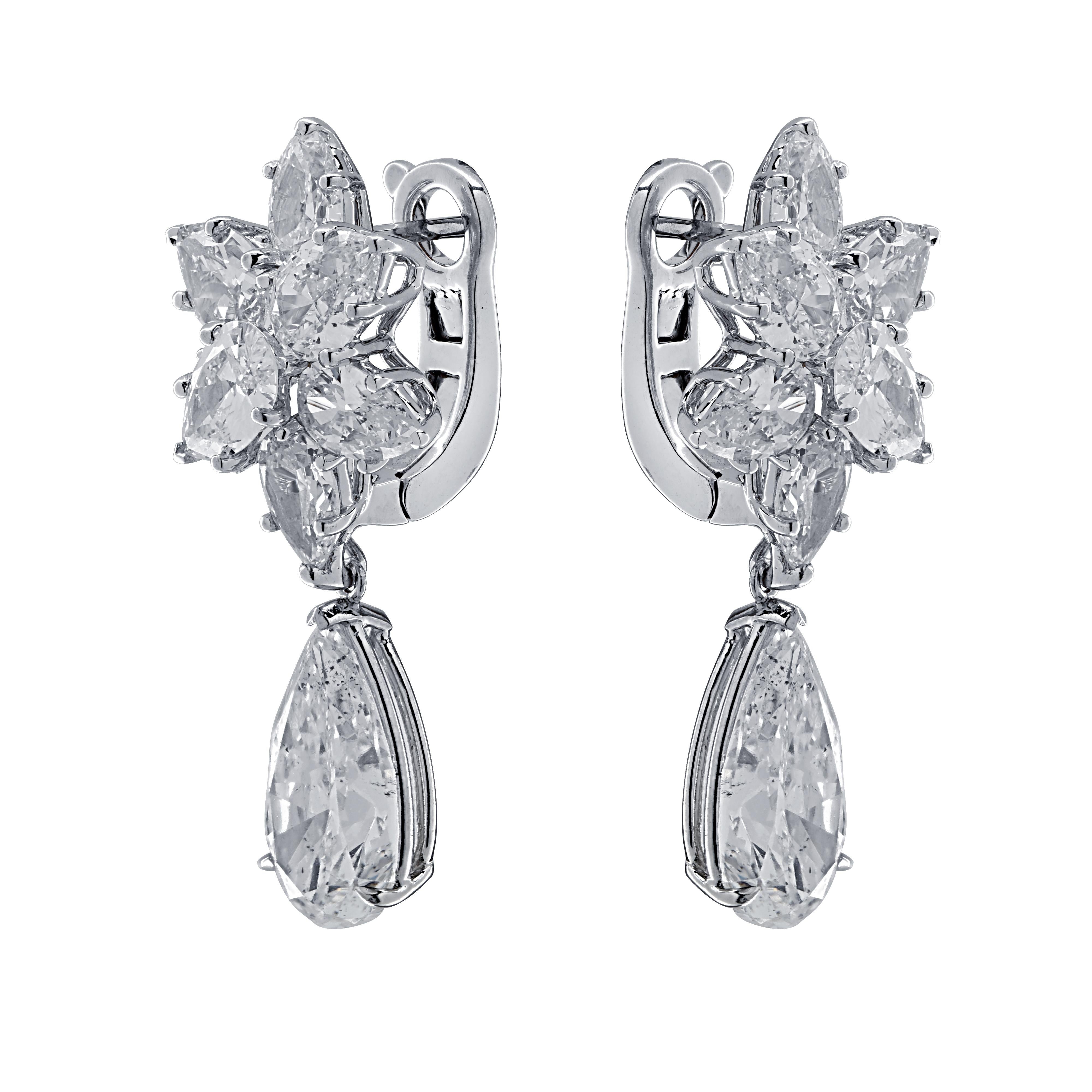 Sensational Vivid Diamonds day and night diamond earrings, finely crafted by hand in 18 karat white gold, showcasing a spectacular GIA certified pear shape diamond weighing 3.04 carats, G color, SI2 clarity, and a spectacular EGLNY Certified pear