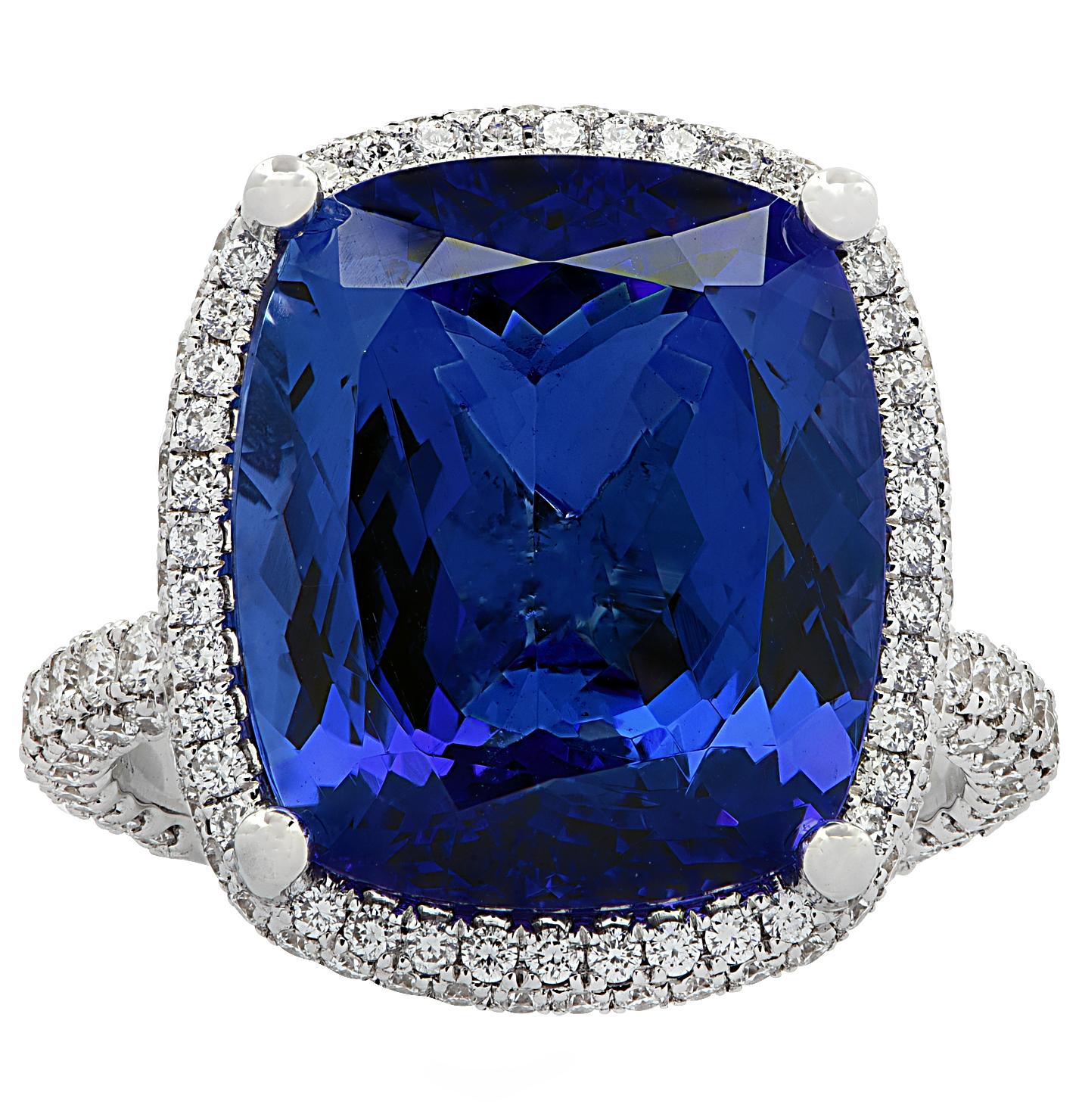 Gorgeous Vivid Diamonds ring crafted in 18 karat white gold, showcasing an exquisite cushion cut Tanzanite weighing 10.66 carats, adorned with 206 round brilliant cut diamonds weighing 1.38 carats total, G color, VS clarity. The magnificent blue