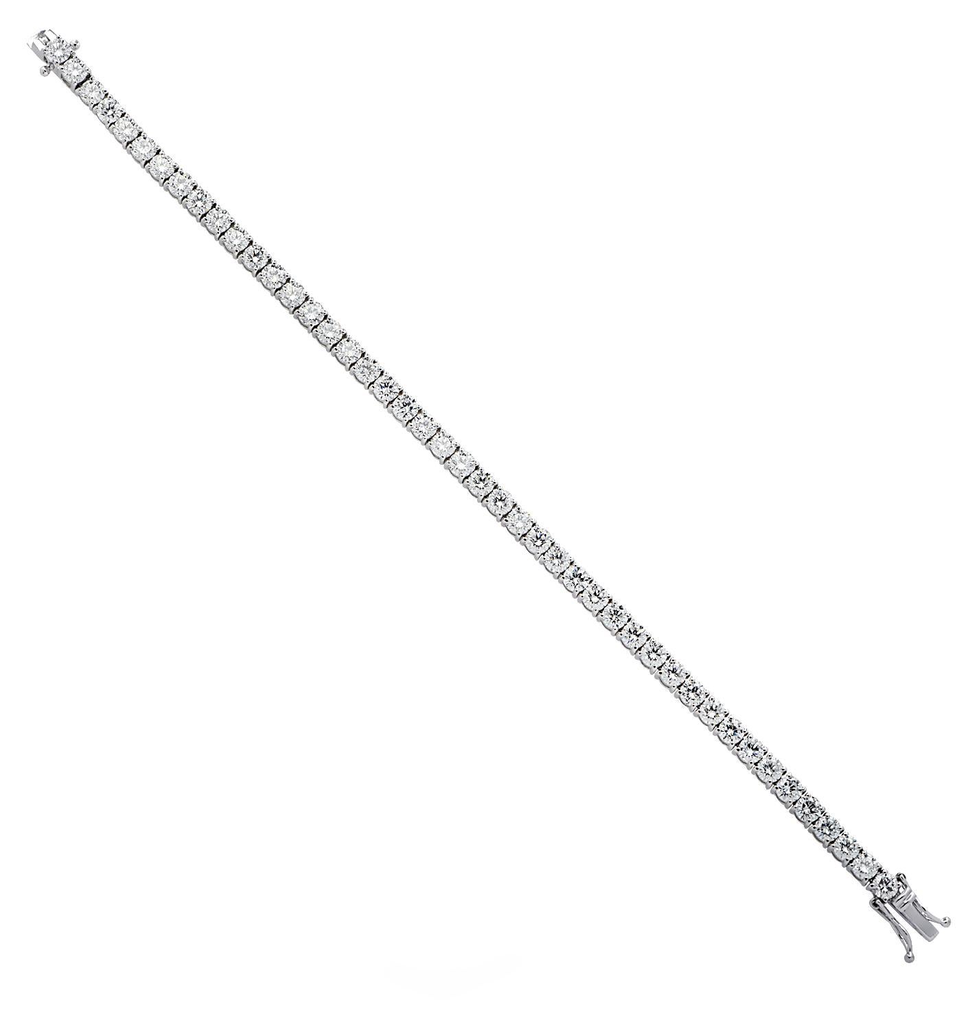 Exquisite Vivid Diamonds diamond tennis bracelet crafted in 18 karat white gold, showcasing 44 stunning round brilliant cut diamonds weighing approximately 11.14 carats total, D-E color, VS-SI clarity. Each diamond is carefully selected, perfectly