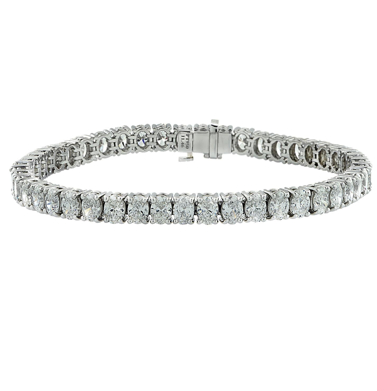 Exquisite diamond tennis bracelet crafted in platinum, showcasing 46 stunning oval cut diamonds weighing 11.23 carats total, E-F color, VS clarity. Each diamond is carefully selected, perfectly matched and set in a seamless eternity of diamonds,