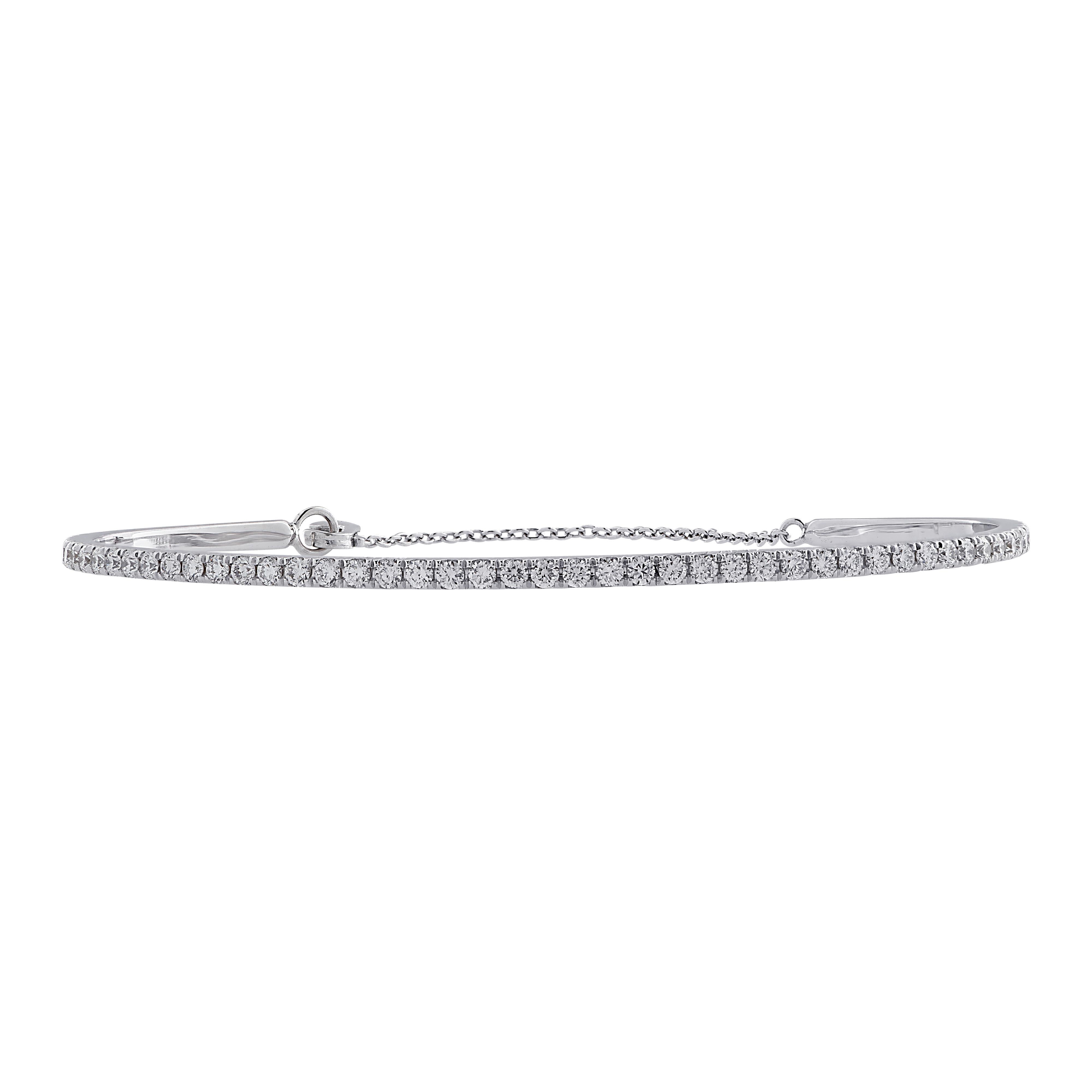 Stunning cuff bangle bracelet crafted in 18 karat white gold showcasing 69 round brilliant cut diamonds weighing 1.25 carats total G color, VS clarity. This elegant bracelet measures 1.8 mm in width and weight 5.4 grams. The diameter measures 2.5