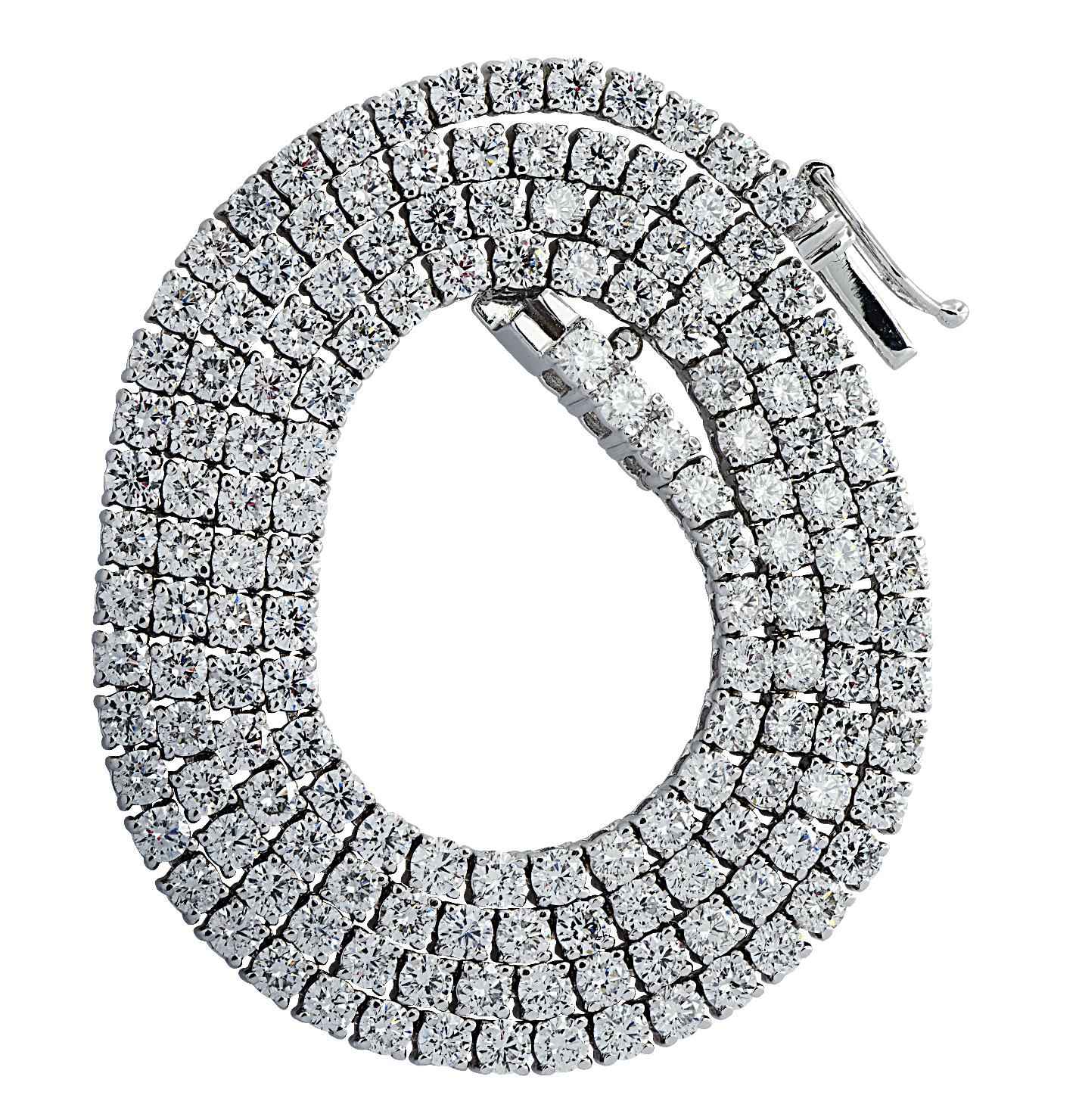 Exquisite Vivid Diamonds Straight Line diamond tennis necklace crafted in White Gold, showcasing 133 round brilliant cut diamonds weighing 12.52 carats, G color, VS-SI Clarity. Each diamond was carefully selected, perfectly matched and set in a