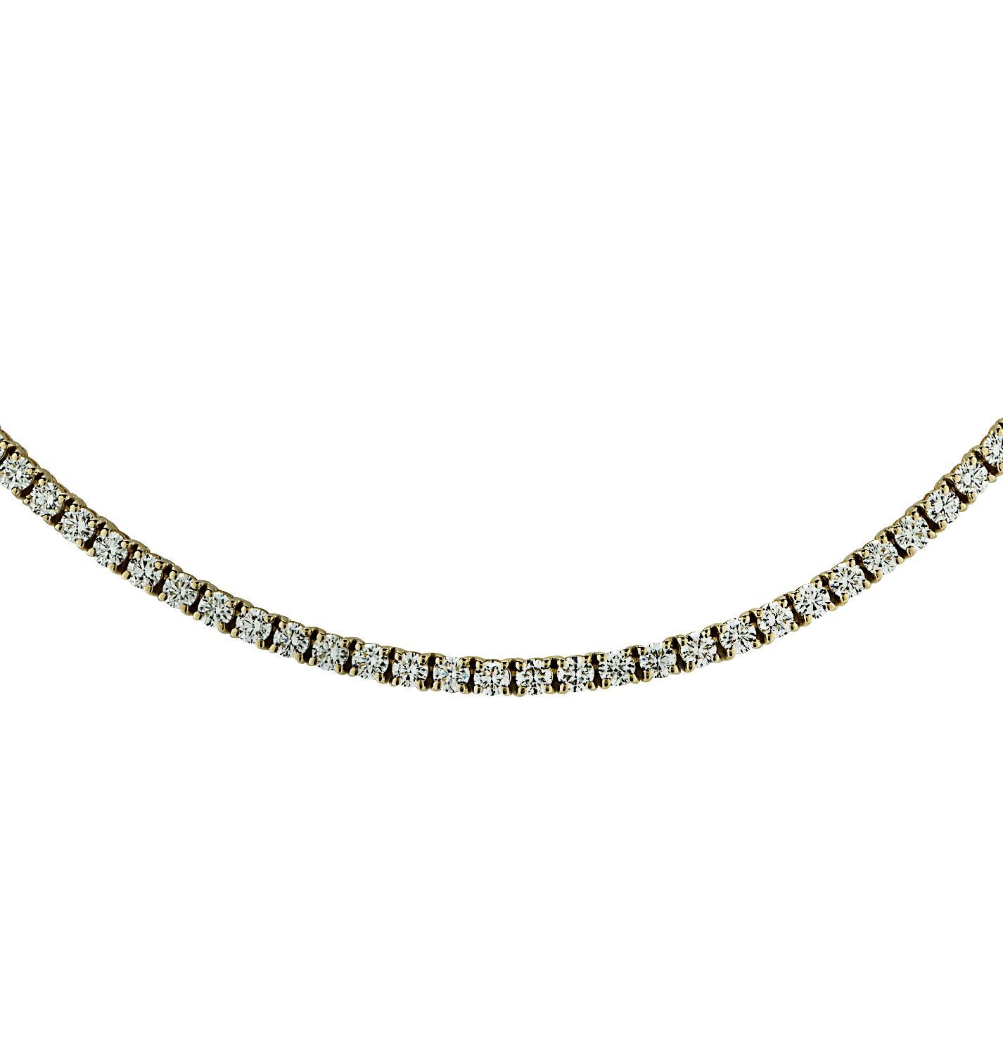 Exquisite diamond tennis necklace is crafted in yellow gold, showcasing 120 stunning round brilliant cut diamonds weighing 14.60 carats total, F-G color, VS clarity. Each diamond was carefully selected, perfectly matched and set in a seamless