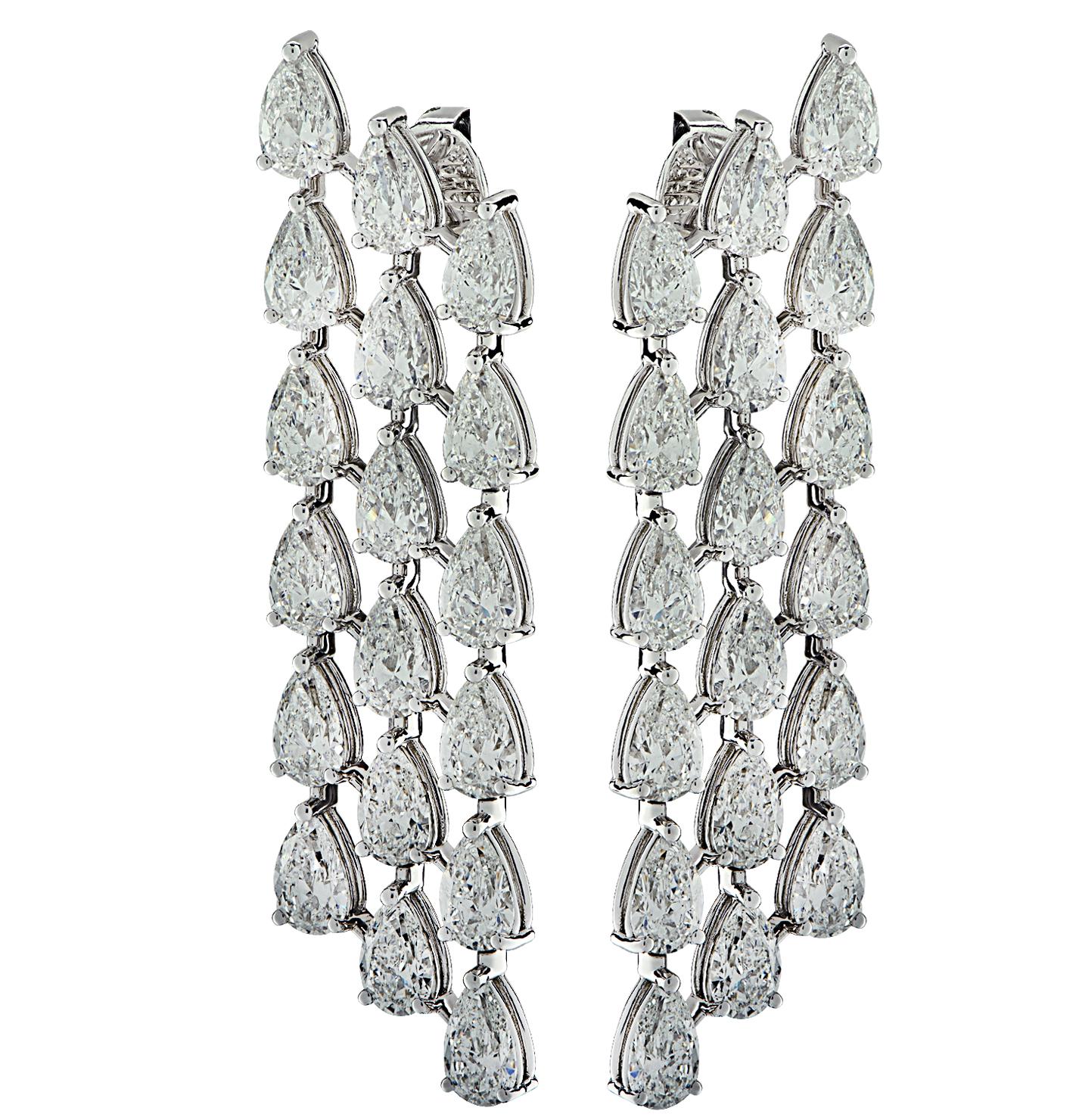 Sensational Vivid Diamonds Dangle Earrings finely crafted by hand in platinum, featuring 36 GIA Certified Pear shape diamonds weighing 14.68 carats total, D-F color, SI1 clarity. Each spectacular diamond was carefully selected, perfectly matched and
