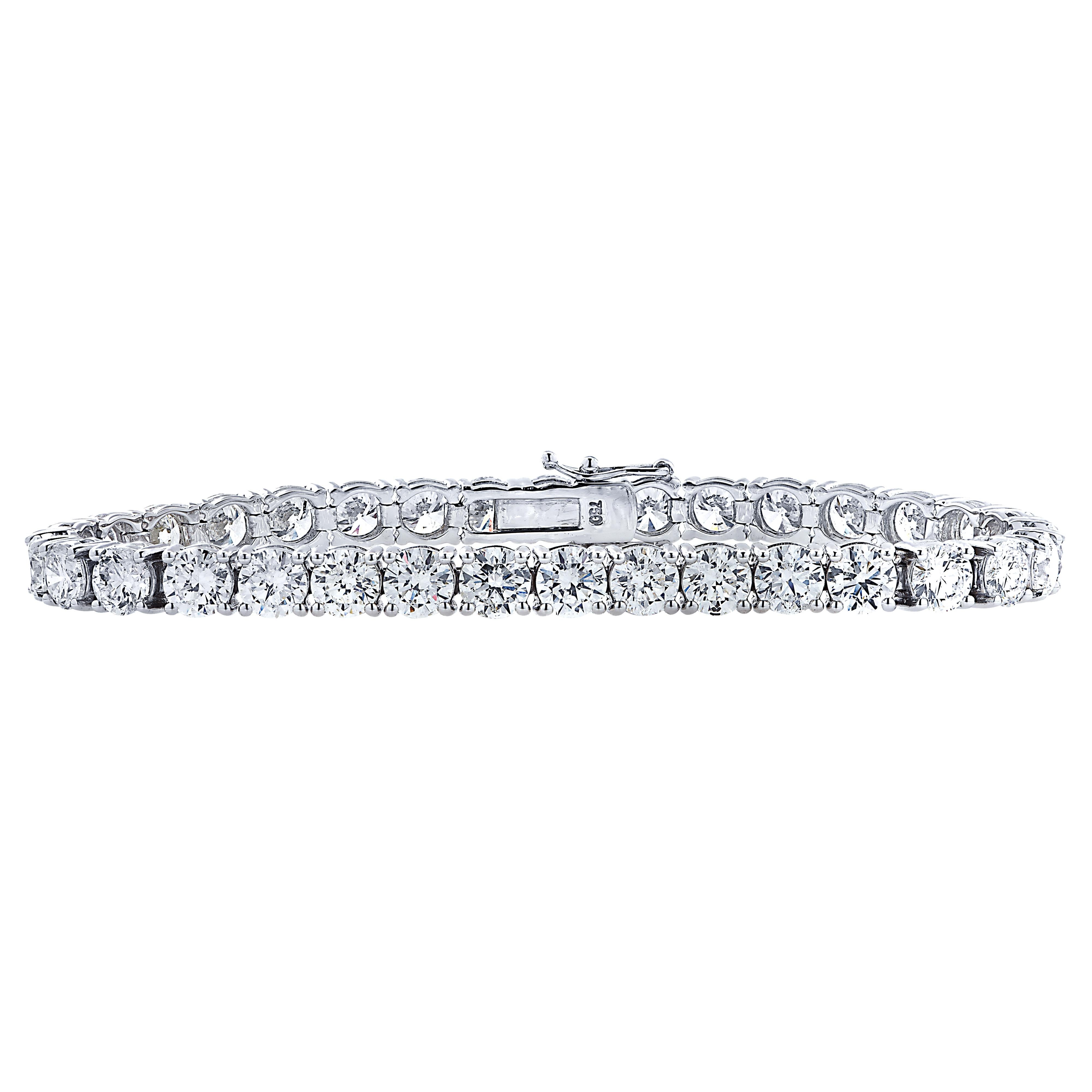 Exquisite diamond tennis bracelet crafted in 18 karat white gold, showcasing 33 stunning round brilliant cut diamonds weighing approximately 16.57 carats total, I color, VS-SI1 clarity. Each diamond is carefully selected, perfectly matched and set