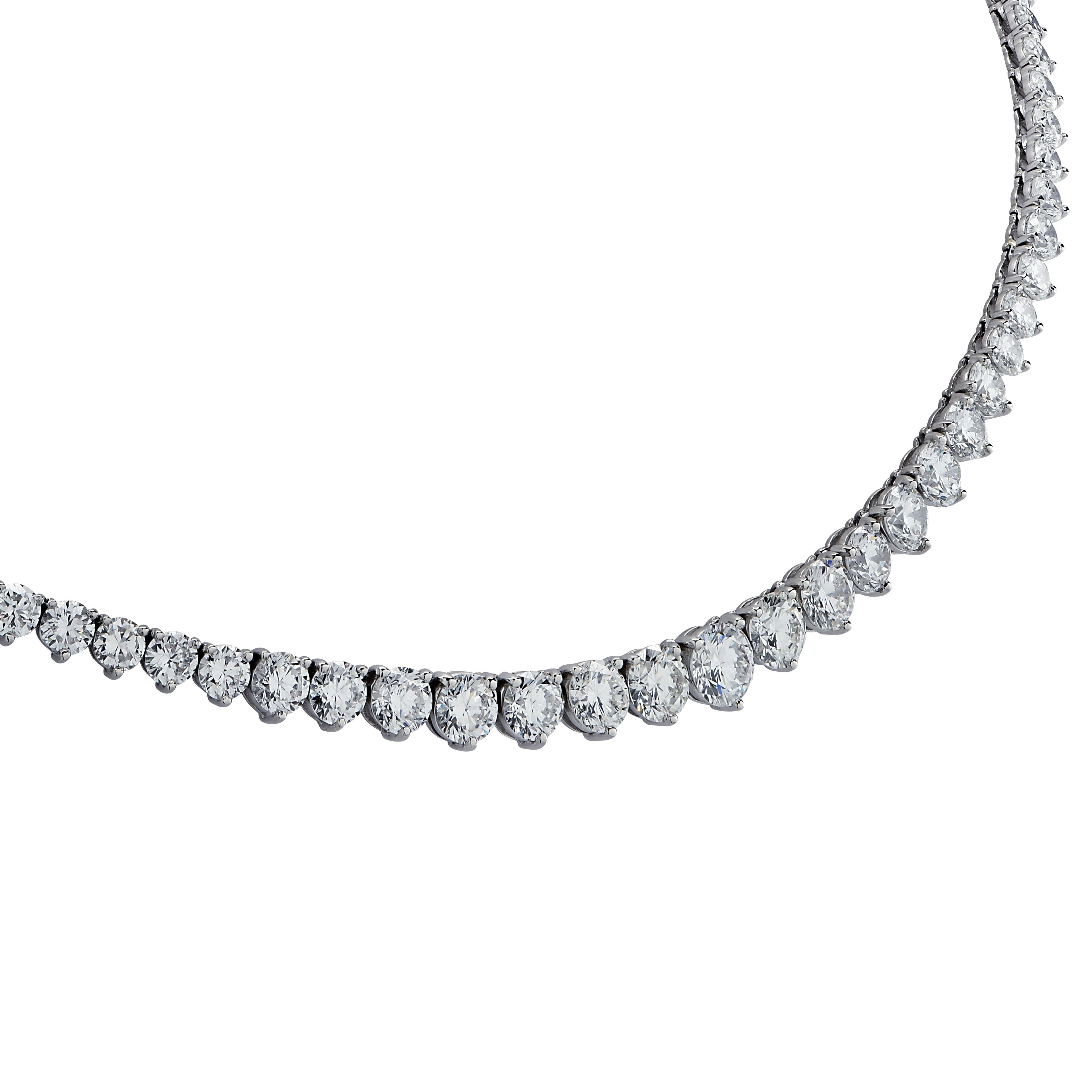 Exquisite diamond riviere necklace crafted in platinum, showcasing 119 round brilliant cut diamonds weighing approximately 18 carats total, D-G color, VS-SI Clarity. Some of the diamonds are GIA certified. The graduating diamonds are set in a