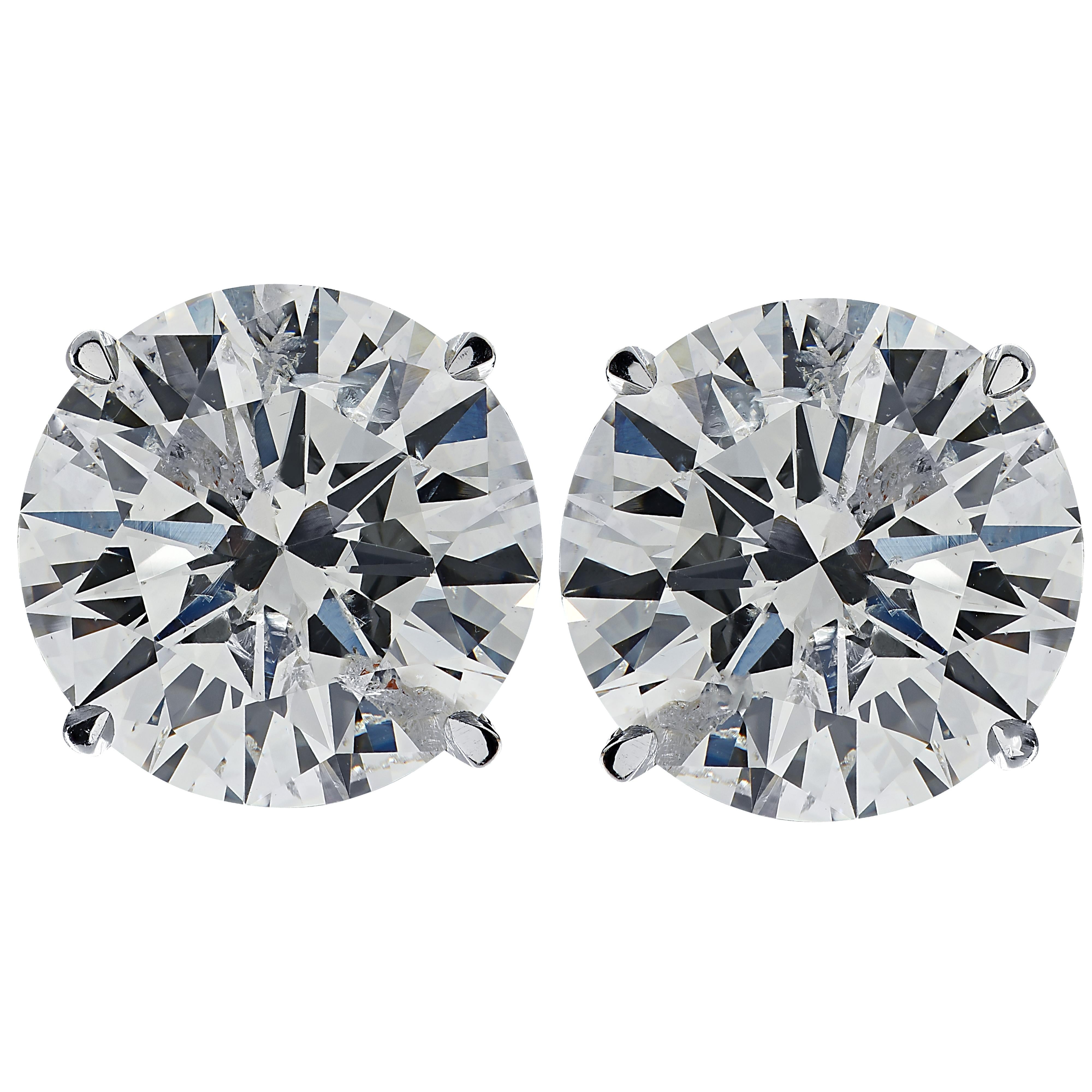 Stunning Vivid Diamonds solitaire stud earrings crafted in white gold, showcasing 2 round brilliant cut diamonds weighing 2.08 carats total, H-I color I1 clarity. These diamonds were carefully selected and perfectly matched to create these classic
