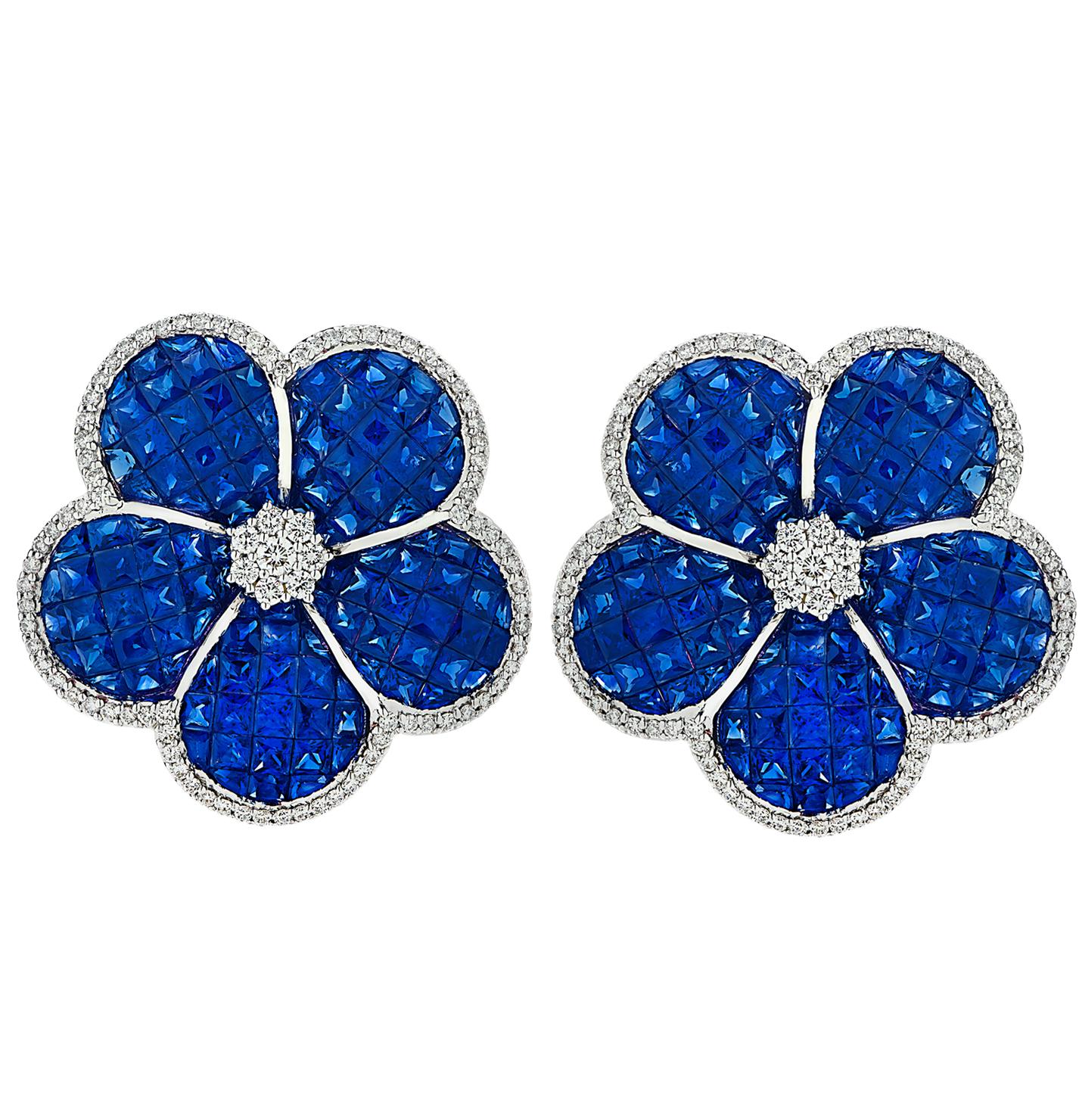 Spectacular Sapphire and diamond leaver back earrings crafted in 18 karat white gold, showcasing 20.05 Carats of invisibly set blue sapphires weighing 22.05 carats, further accented by 1.44 carats of round brilliant cut diamonds, G Color, VS