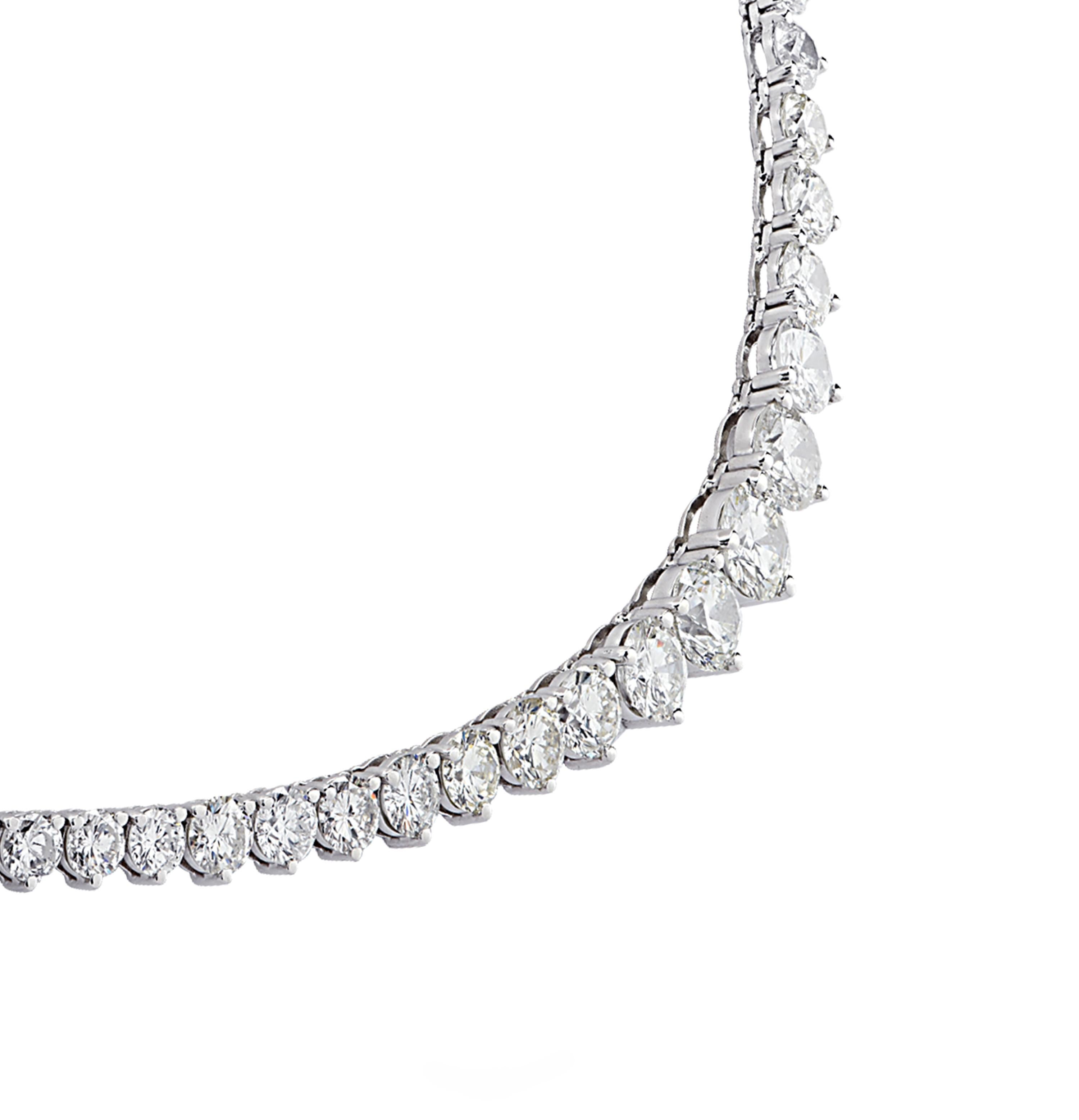 Exquisite Vivid Diamonds diamond necklace crafted in 18 karat white gold, showcasing 102 round brilliant cut diamonds weighing 22.7 carats total, H-I color, VS-SI Clarity, graduating in size. Four of the diamonds are certified by the GIA. The