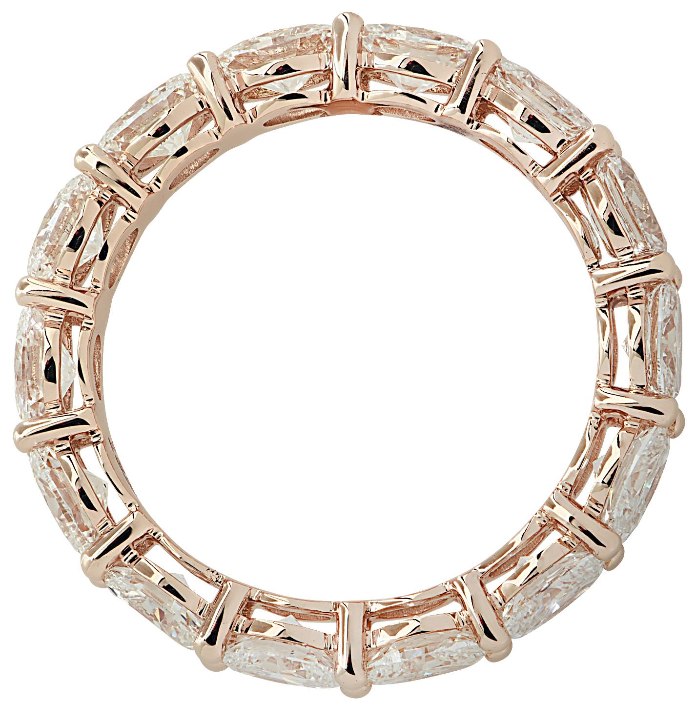 Stunning Vivid Diamonds East-West Eternity Band crafted in 18 karat Rose Gold, featuring 14 oval cut diamonds weighing 2.65 carats total, D-E color, VVS clarity. These fine diamonds are seamlessly set, east-west, in a modern take on the classic