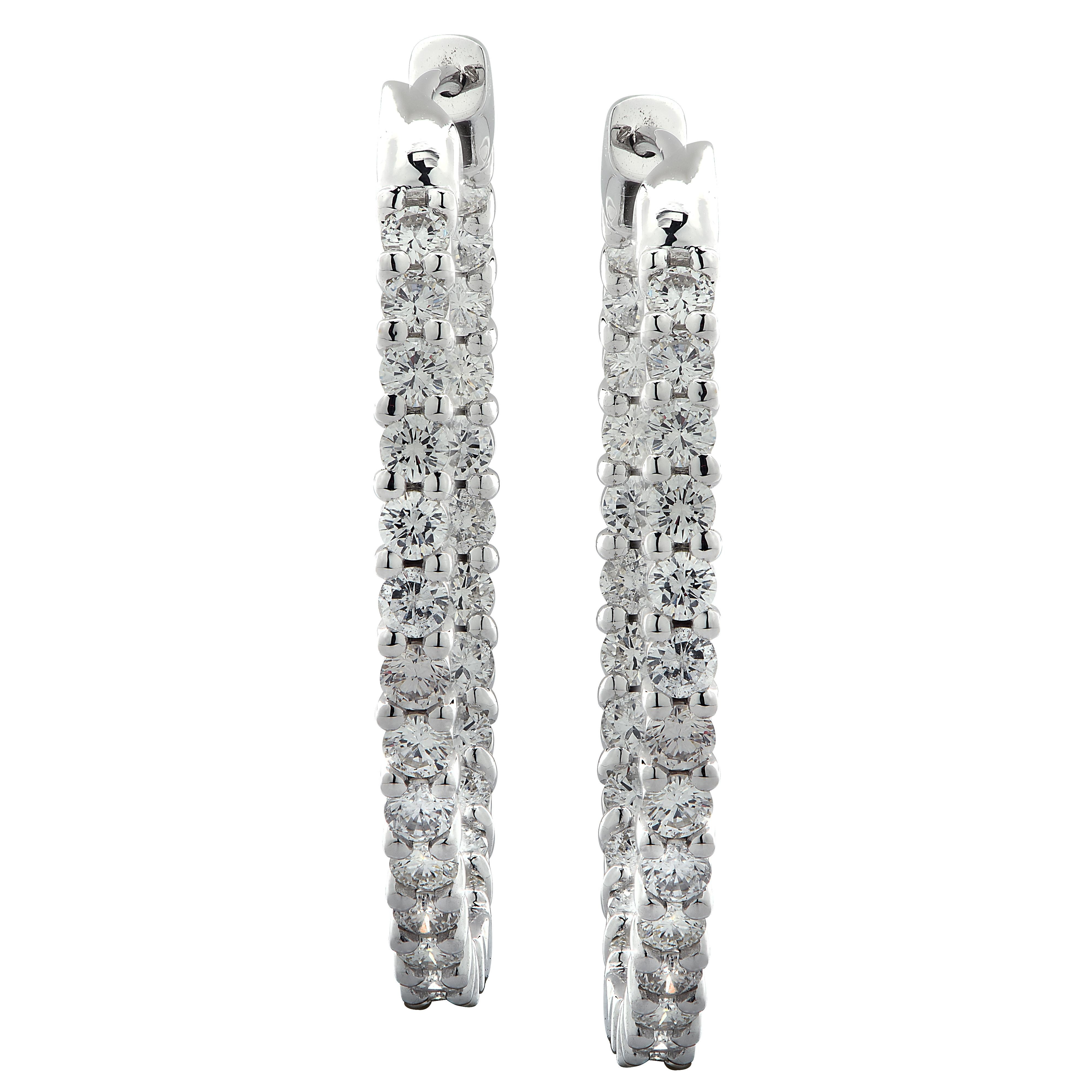 Spectacular Vivid Diamonds In/Out diamond hoop earrings crafted in 18 karat white gold showcasing 54 round brilliant cut diamonds weighing 2.83 carats total, G-H color, VS-SI clarity. Each diamond is carefully selected, perfectly matched and set on