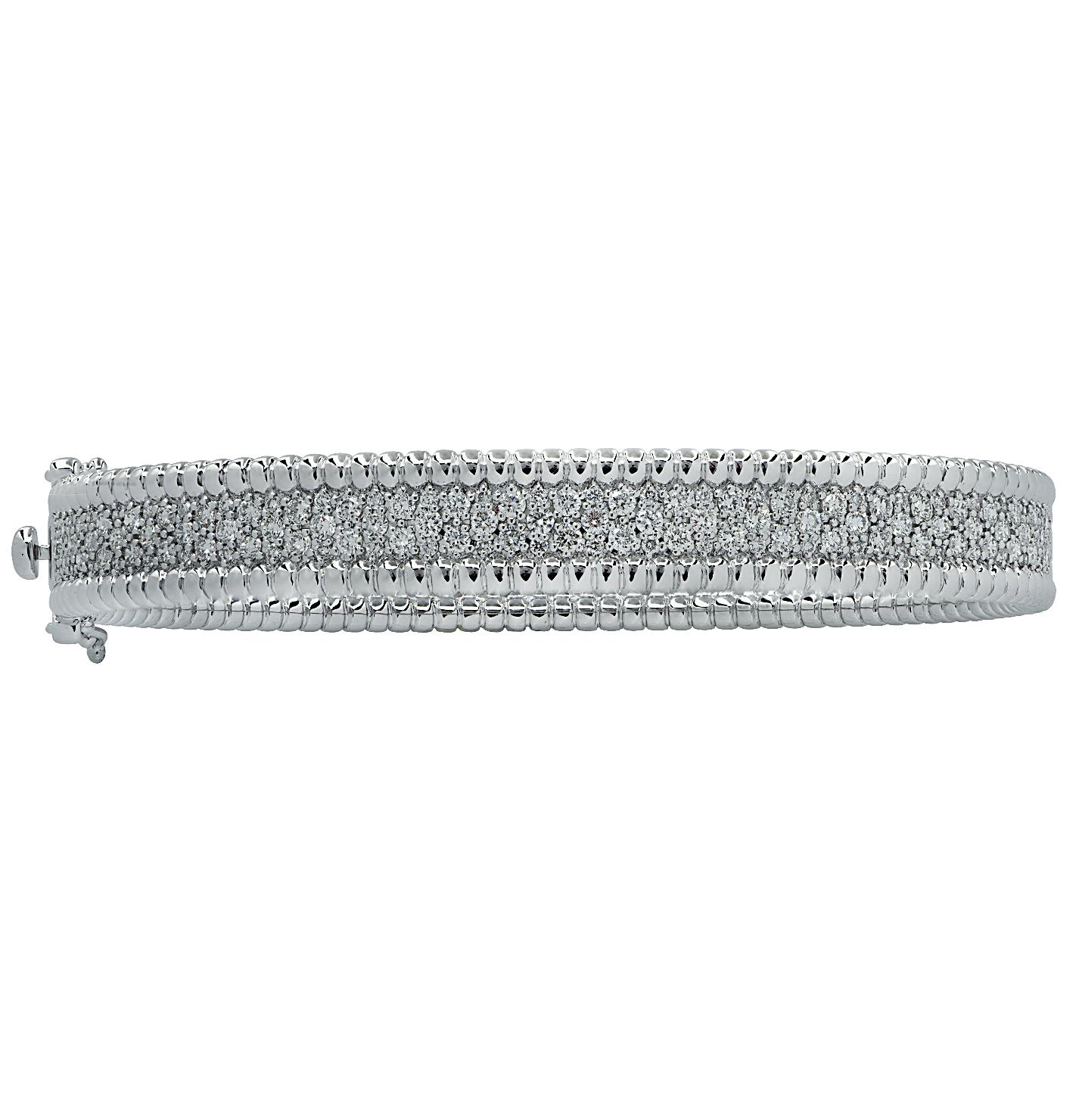 Stunning Vivid Diamonds Bangle Bracelet crafted in white gold, featuring 262 round brilliant cut diamonds weighing 2.88 carats total, F-G color, VS-SI clarity. This elegant bangle is set with three rows of diamonds, laced with white gold beads