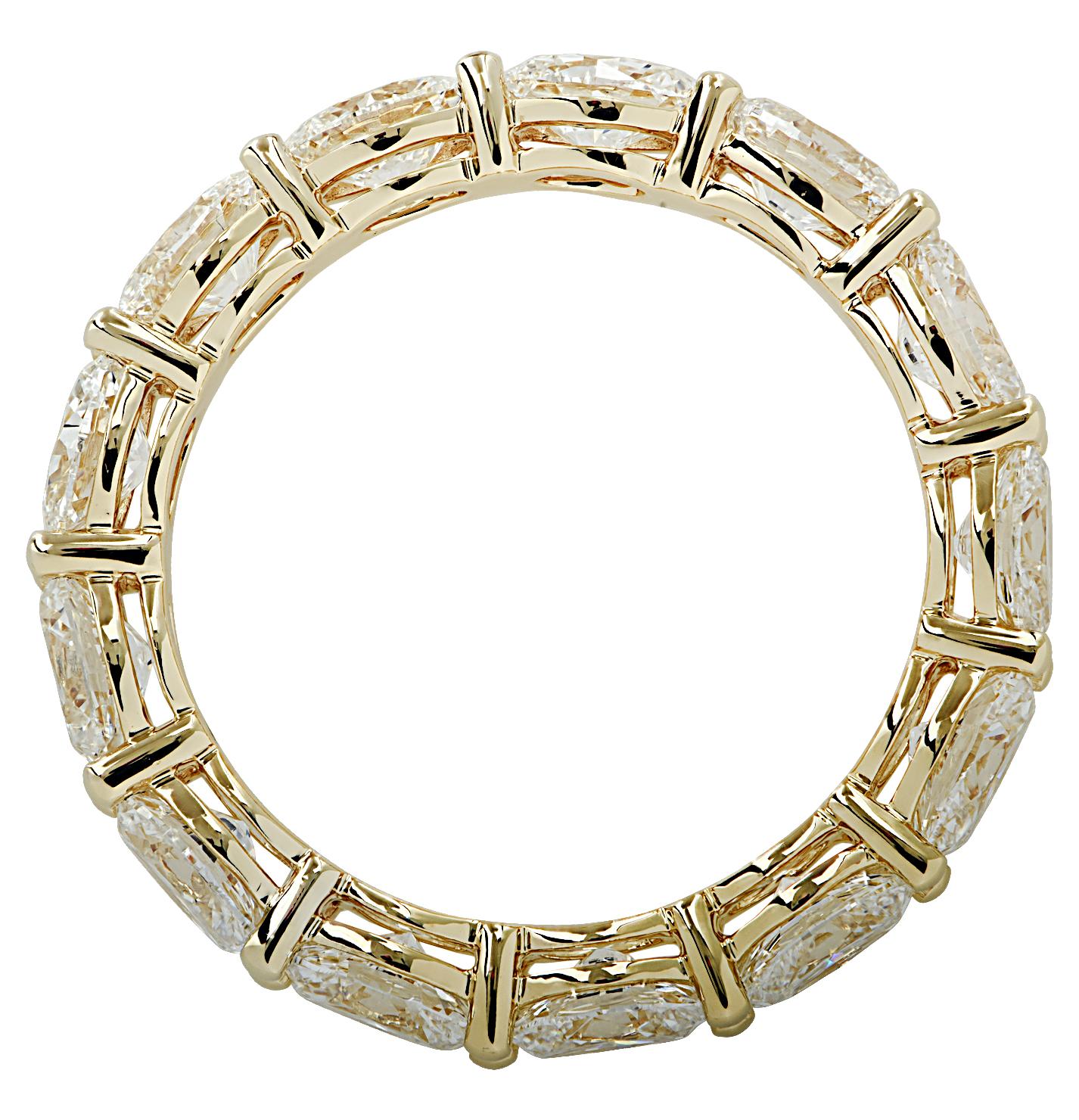 Stunning Vivid Diamonds Eternity Band crafted in 18 karat yellow gold, featuring 13 oval cut diamonds weighing 3.08 carats total, E-F color, VS clarity. The diamonds were carefully selected, perfectly matched and set East-West in a spectacular