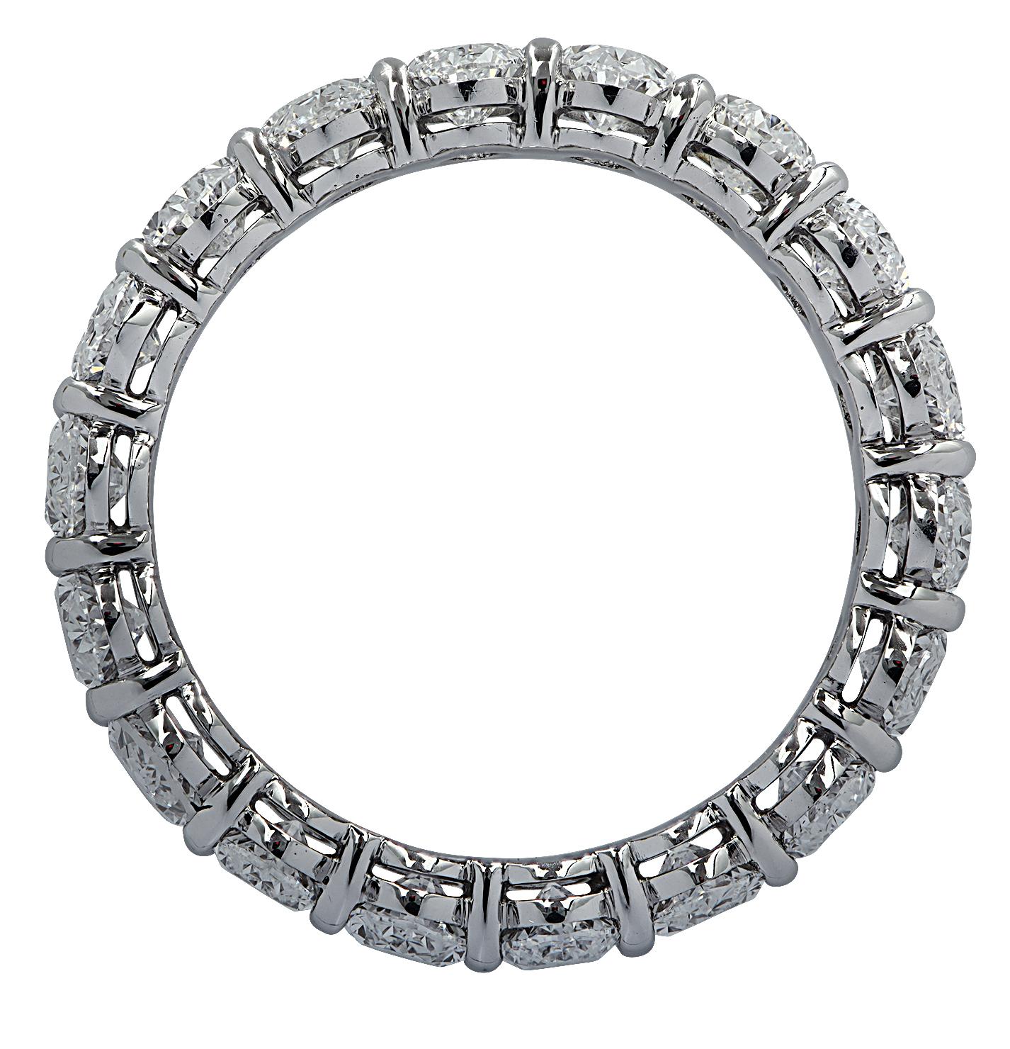 Exquisite Vivid Diamonds eternity band crafted in Platinum, showcasing 18 stunning oval cut diamonds weighing 3.66 carats total, D-E-F color, VVS-VS clarity. Each diamond was carefully selected, perfectly matched and set in a seamless sea of