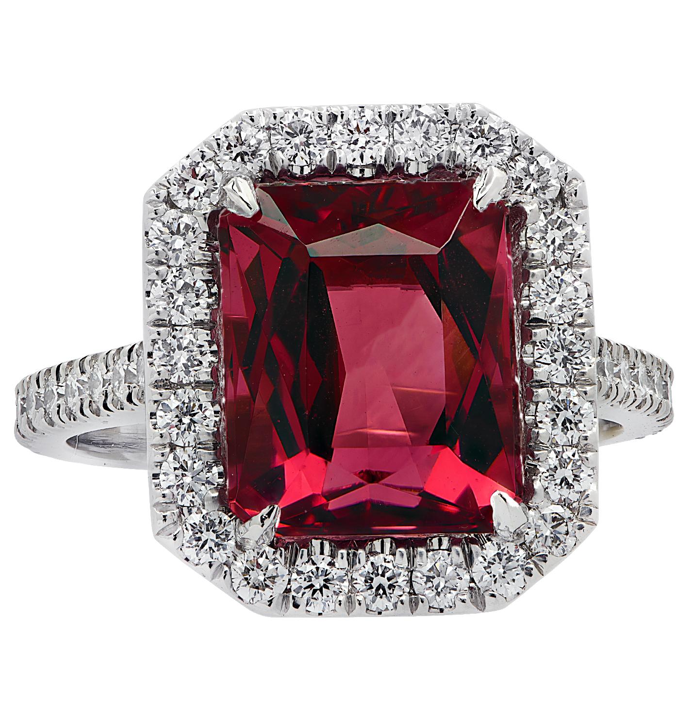 Sensational Vivid Diamonds halo engagement ring crafted in platinum showcasing an exquisite Radiant Cut Rubelite Tourmaline weighing 3.90 carats. The halo and band of this spectacular ring are adorned with 46 carefully selected and perfectly matched