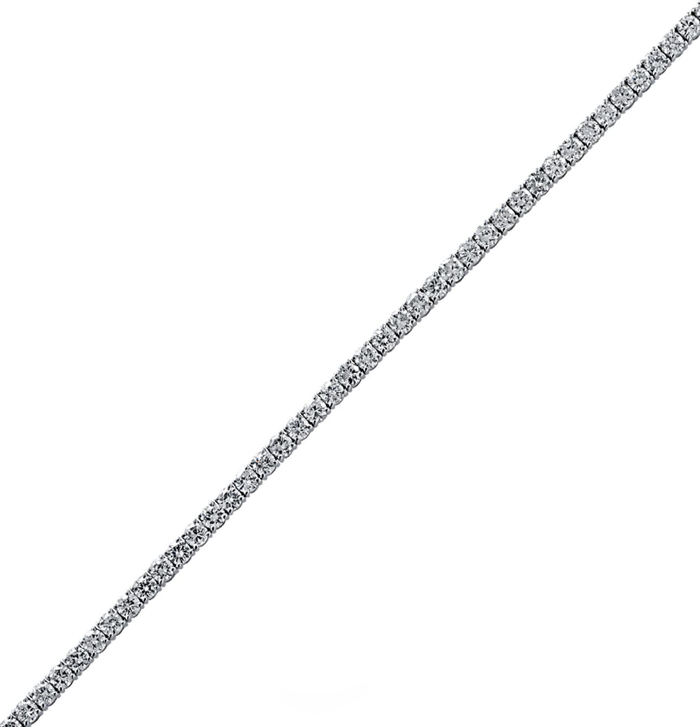 Exquisite Vivid Diamonds diamond tennis bracelet crafted in 18 karat white gold, showcasing 62 stunning round brilliant cut diamonds weighing 5.51 carats total, G-I color, SI clarity. Each diamond is carefully selected, perfectly matched and set in