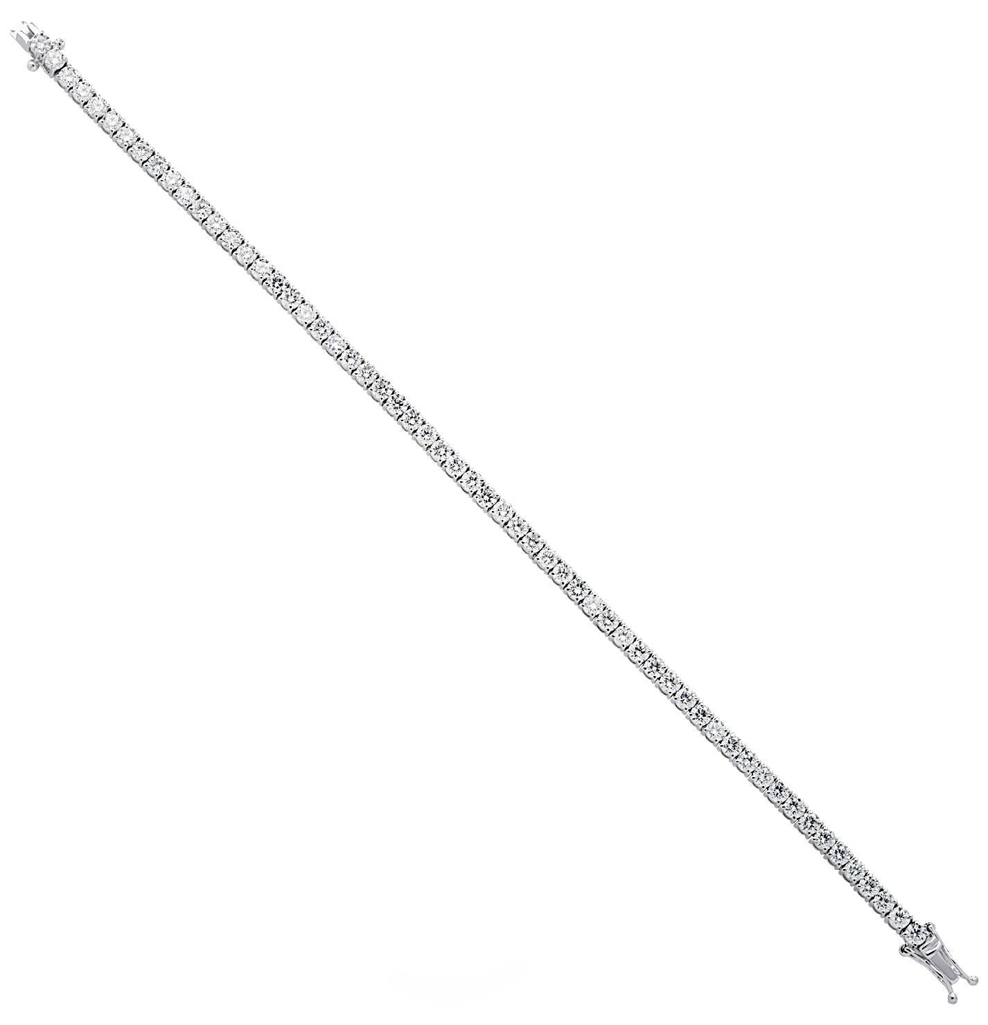 Exquisite Vivid Diamonds diamond tennis bracelet crafted in 18 karat white gold, showcasing 59 stunning round brilliant cut diamonds weighing approximately 5.71 carats total, G-I color, VS-SI clarity. Each diamond is carefully selected, perfectly