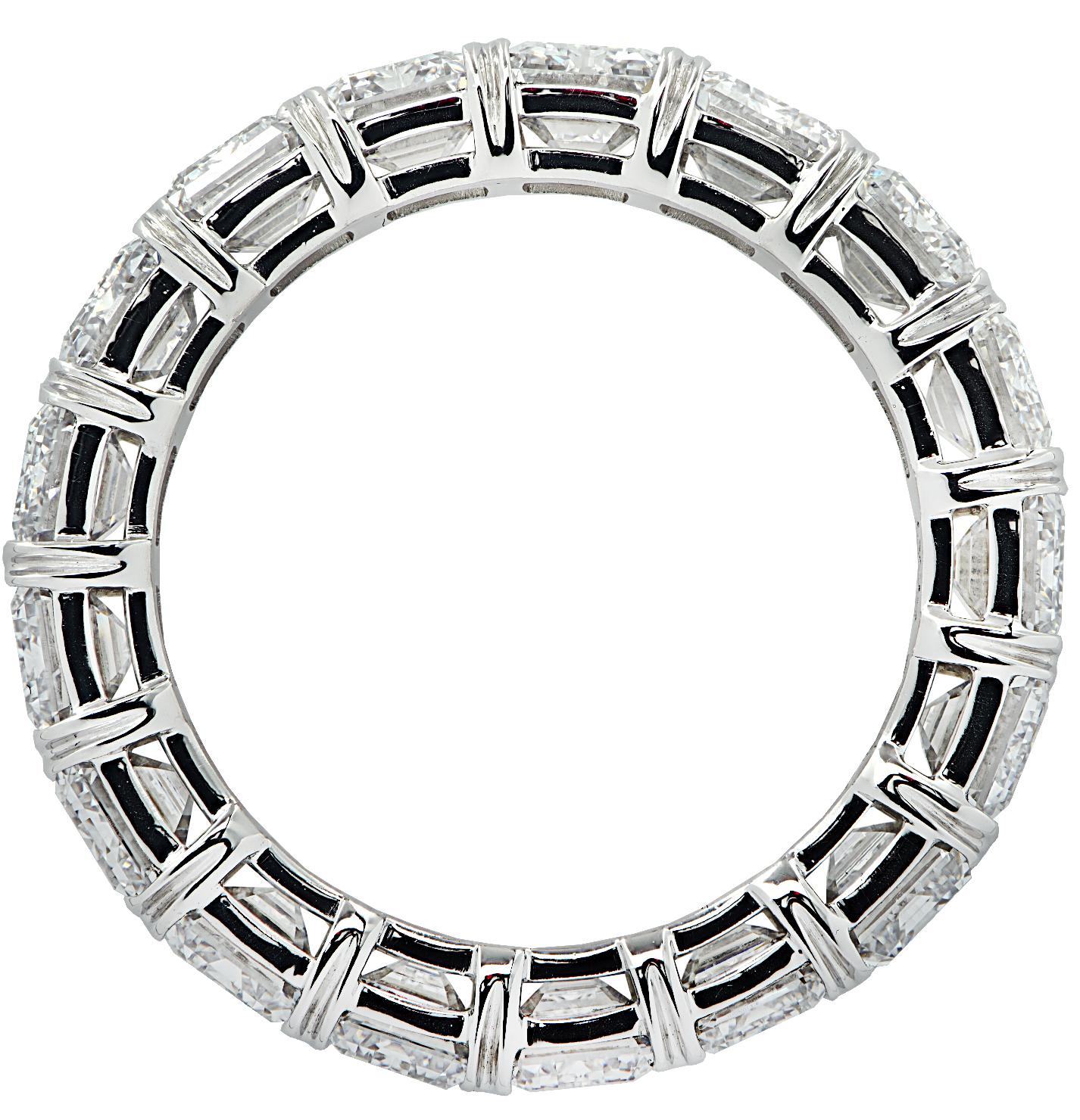 Exquisite Vivid Diamonds eternity band crafted in Platinum, showcasing 18 stunning radiant cut diamonds weighing 5.71 carats total, F-G color, VVS-VS clarity. Each diamond was carefully selected, perfectly matched and set in a seamless sea of
