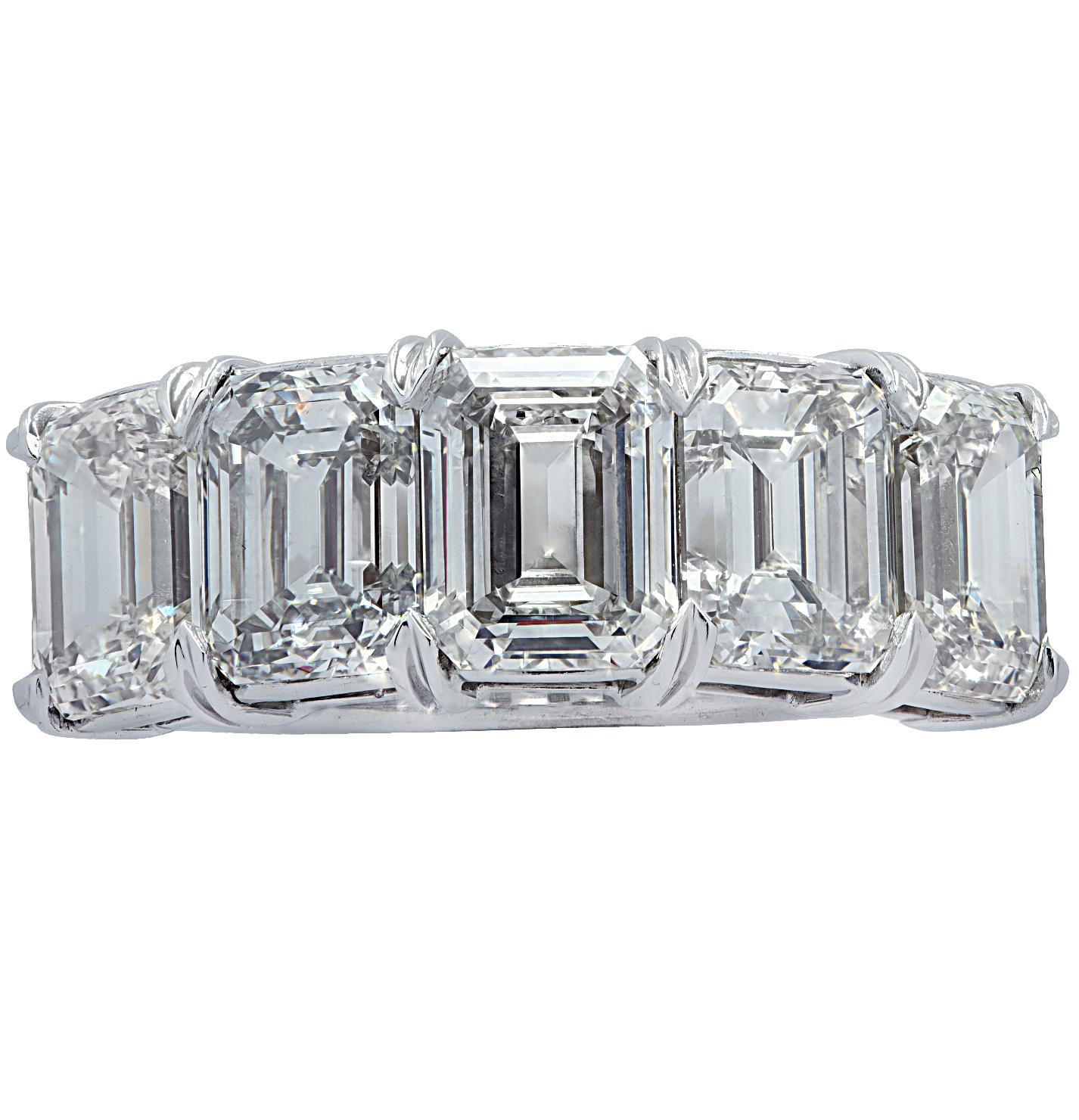 Stunning Vivid Diamonds five stone wedding band crafted in platinum, showcasing 5 spectacular emerald cut diamonds weighing 6.02 carats total, J-K color, VS clarity. Each diamond was carefully selected, perfectly matched and set in a seamless sea of