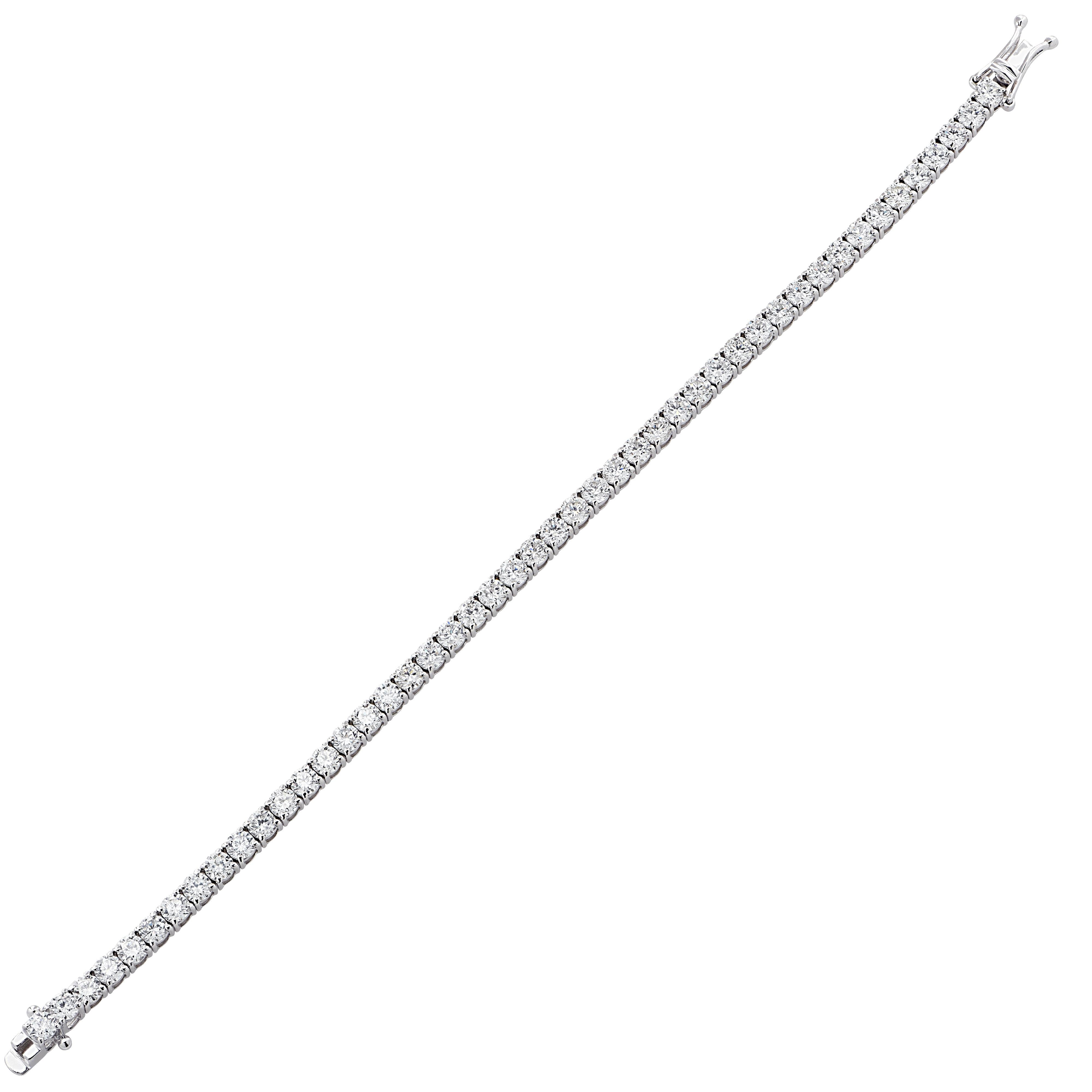 Exquisite Vivid Diamonds diamond tennis bracelet crafted in 18 karat white gold, showcasing 57 stunning round brilliant cut diamonds weighing approximately 6.36 carats total, G-I color, SI clarity. Each diamond is carefully selected, perfectly