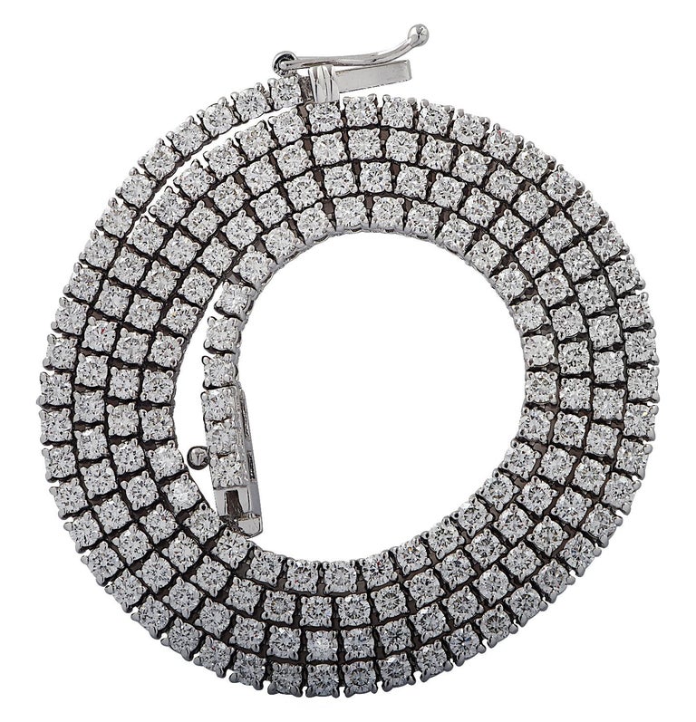 Exquisite Vivid Diamonds Straight Line diamond tennis necklace crafted in 18 karat White Gold, showcasing 179 round brilliant cut diamonds weighing 7.10 carats, G color, SI Clarity. Each diamond was carefully selected, perfectly matched and set in a