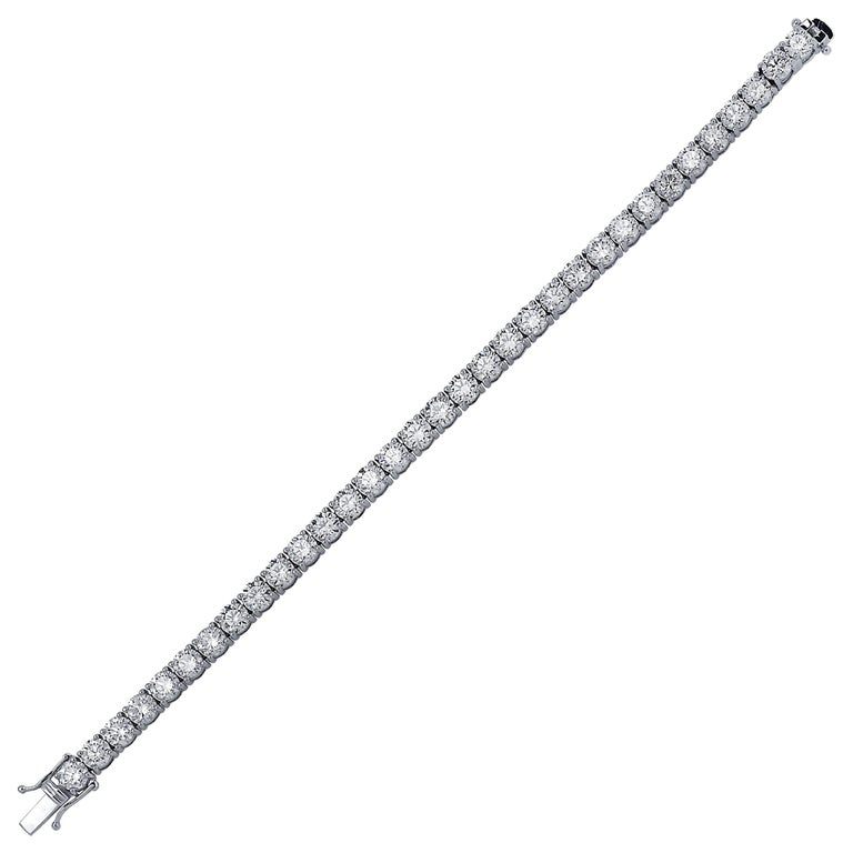 Exquisite Vivid Diamonds diamond tennis bracelet crafted in 18 karat white gold, showcasing 47 stunning round brilliant cut diamonds weighing 8.90 carats total, D color, SI clarity. Each diamond is carefully selected, perfectly matched and set in a