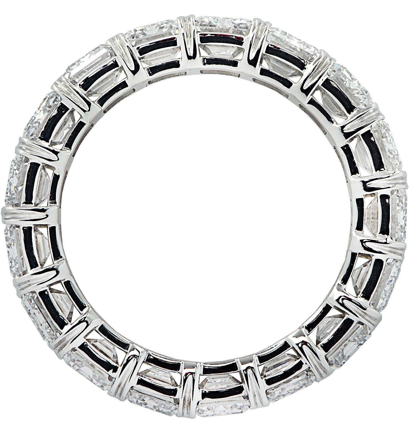 Exquisite Vivid Diamonds eternity band crafted in Platinum, showcasing 18 stunning emerald cut diamonds weighing 9.44 carats total, D-F color, VVS-VS clarity. Each diamond was carefully selected, perfectly matched, and set in a seamless sea of