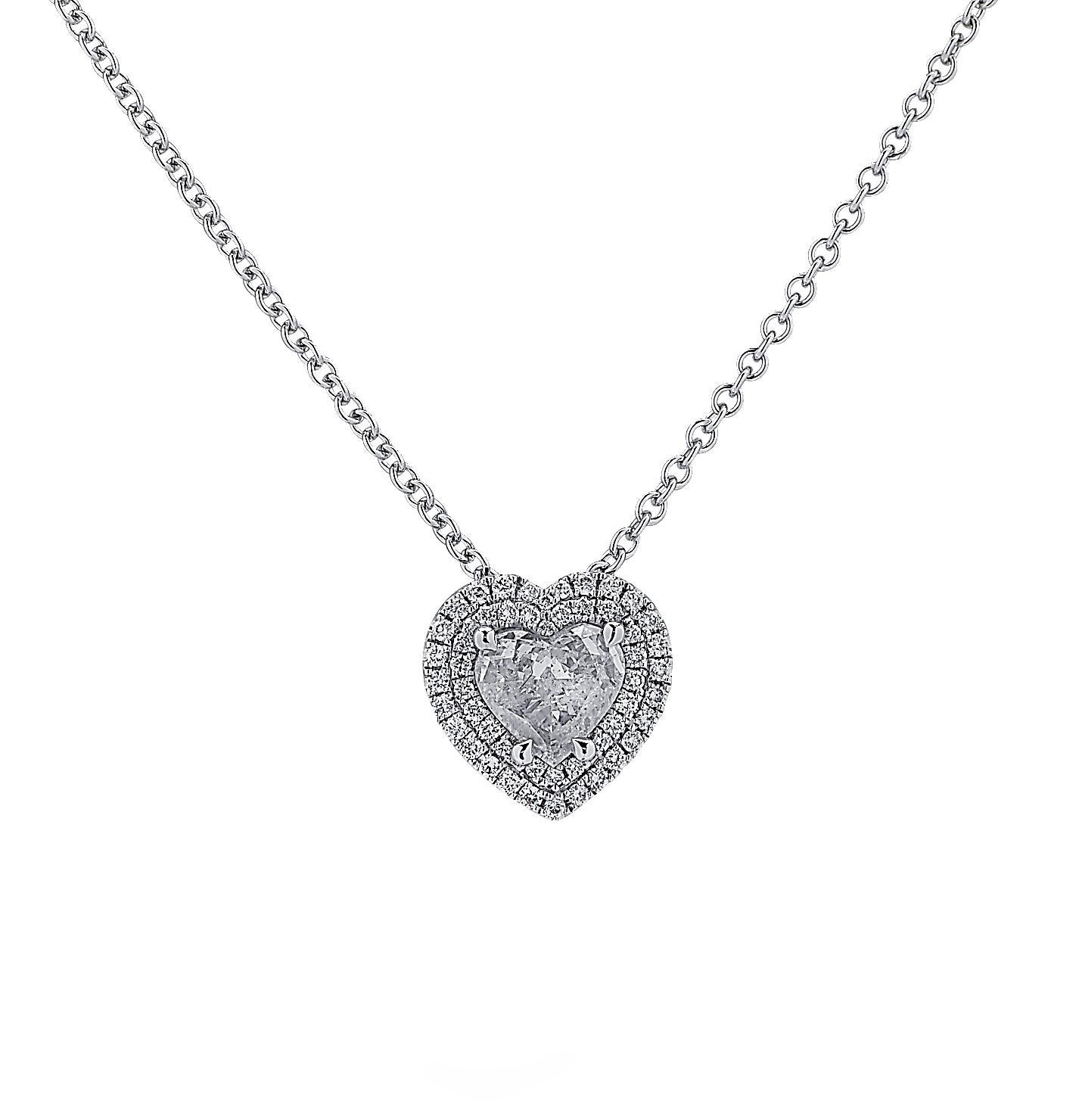 Stunning Vivid Diamonds Necklace crafted in 18 karat white gold, showcasing a heart shaped diamond weighing 0.98 carats, G color, I1 clarity, framed with a double halo encrusted with 43 round brilliant cut diamonds weighing 0.23 carats total, F