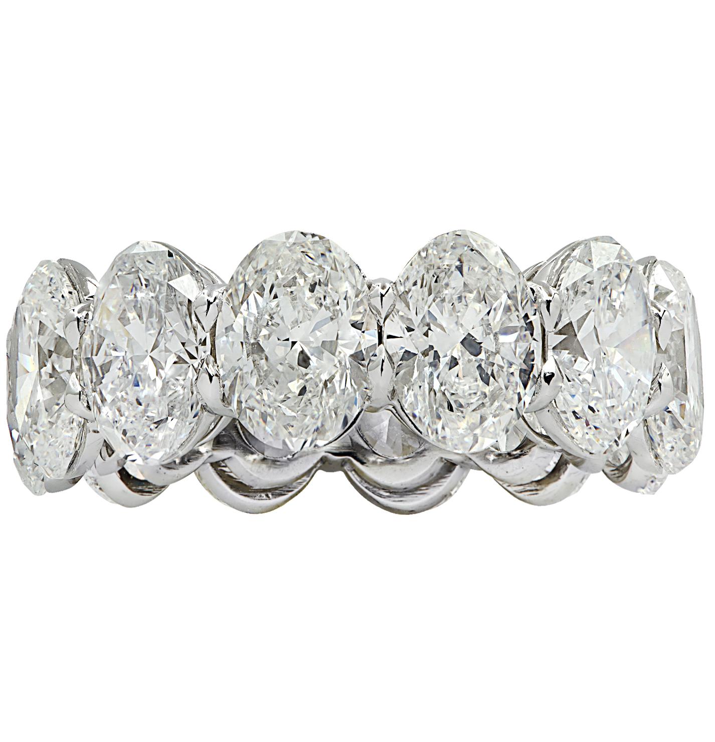 Exquisite Vivid Diamonds eternity band hand crafted in Platinum, showcasing 12 stunning GIA Certified oval diamonds weighing 12.10 carats total, D-F color, VVS-VS clarity. Each diamond was carefully selected, perfectly matched and set in a seamless