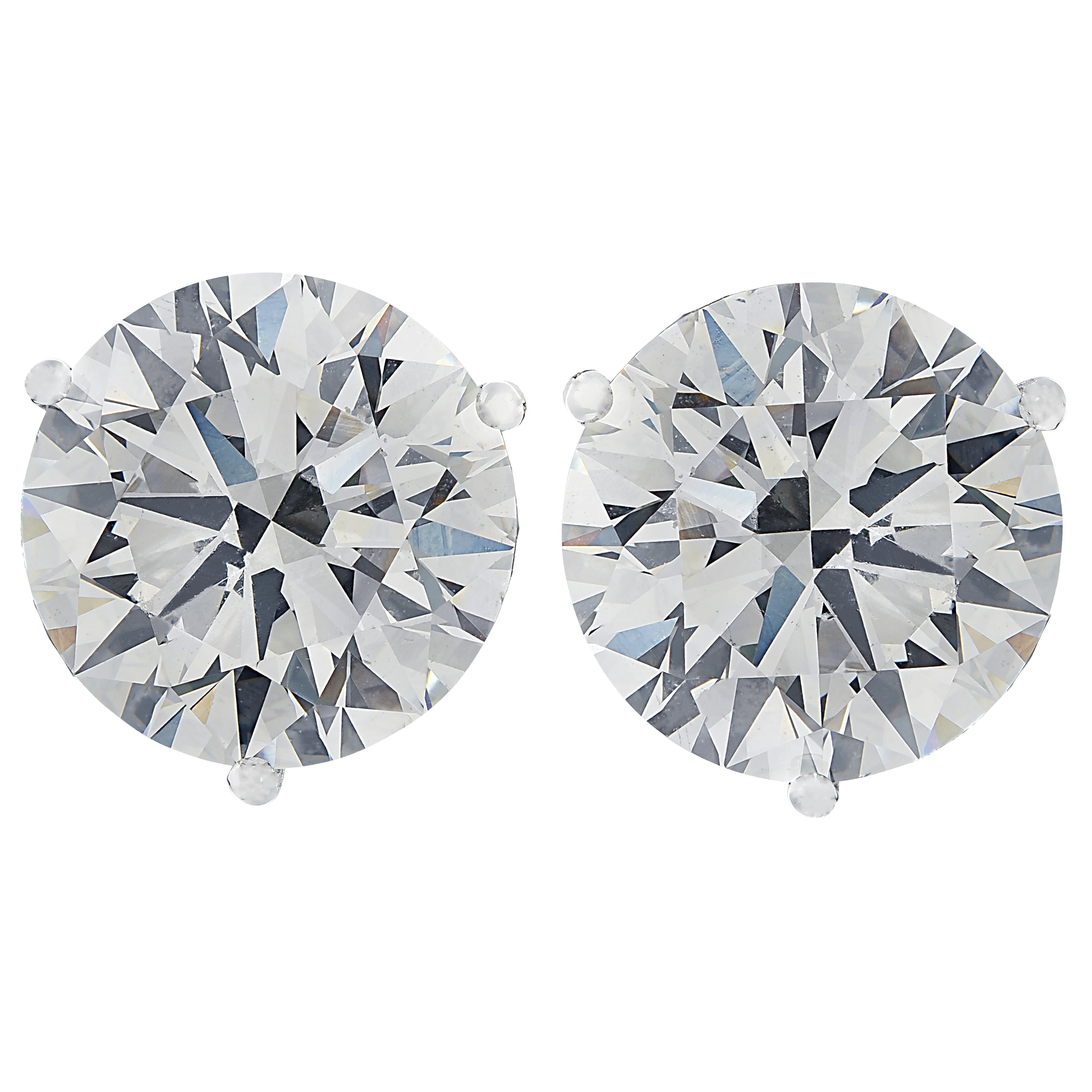 Stunning Vivid Diamonds solitaire stud earrings crafted in 18 karat white gold, showcasing 2 spectacular GIA certified round brilliant cut diamonds weighing 2.01 carats total, G color SI2 clarity. These diamonds were carefully selected and perfectly