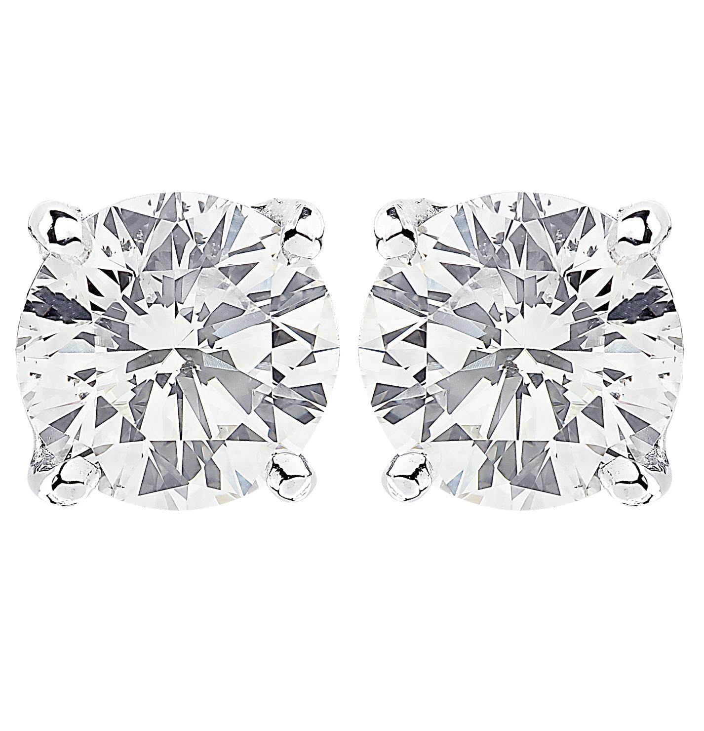 Stunning Vivid Diamonds solitaire stud earrings crafted in 18 karat white gold, showcasing 2 spectacular GIA Certified round brilliant cut diamonds weighing 2.06 carats total, L color SI1 clarity. These diamonds were carefully selected and perfectly
