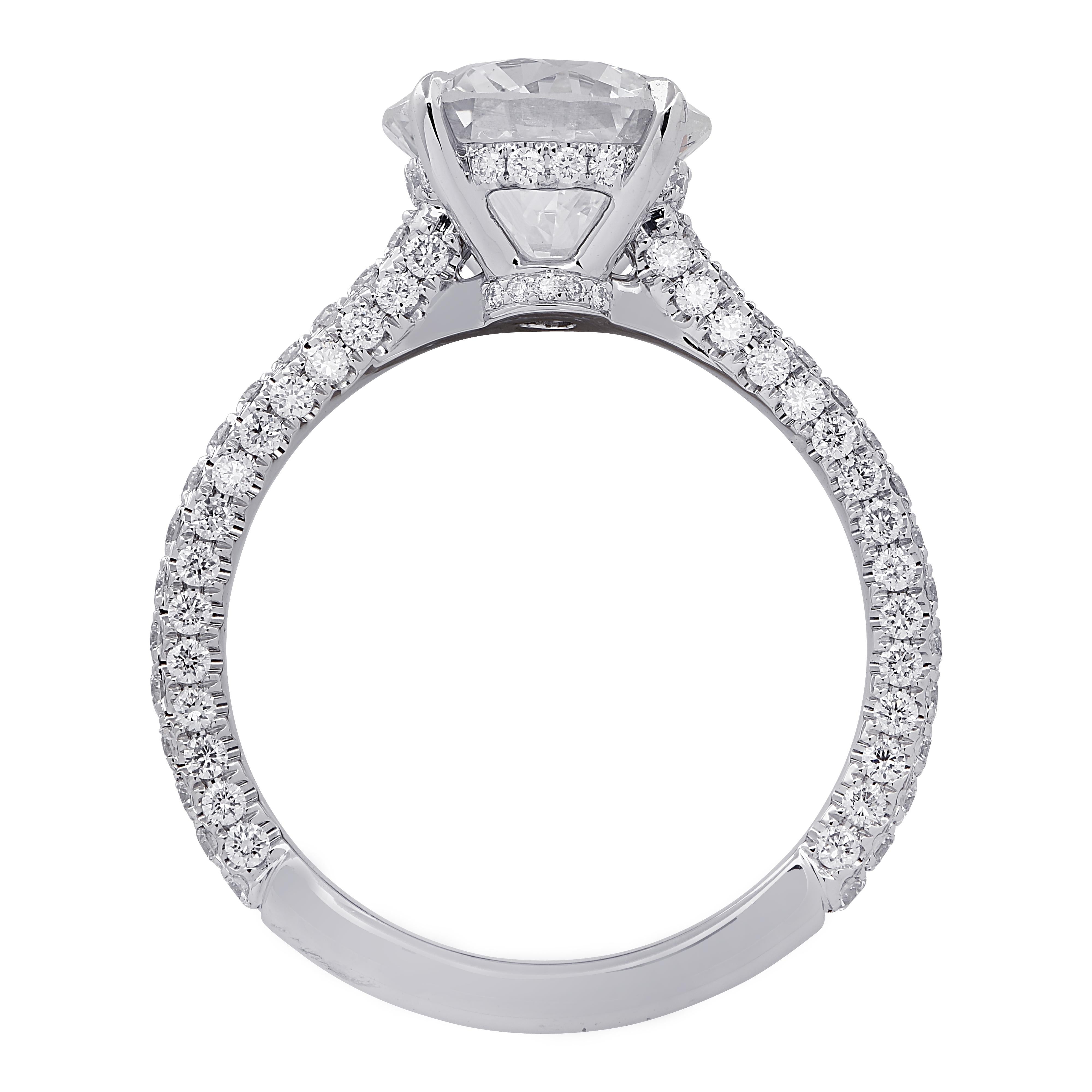 Spectacular Vivid Diamonds engagement ring finely crafted in platinum showcasing a stunning GIA certified round brilliant cut diamond weighing 2.09 carats, G color, SI2 clarity. The band and basket of this sensational ring are encrusted with 116