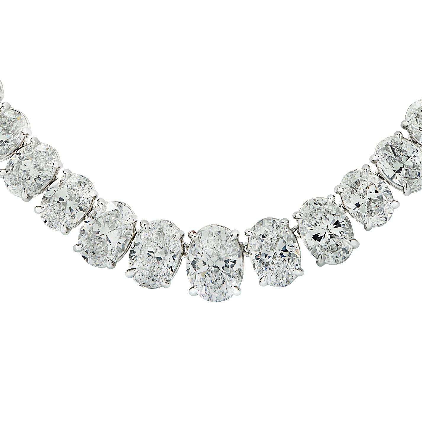 Emerging from the esteemed atelier of Vivid Diamonds, this captivating Riviera diamond necklace manifests the pinnacle of artistry and refinement. Meticulously shaped in platinum, it magnificently exhibits a constellation of 73 GIA Certified