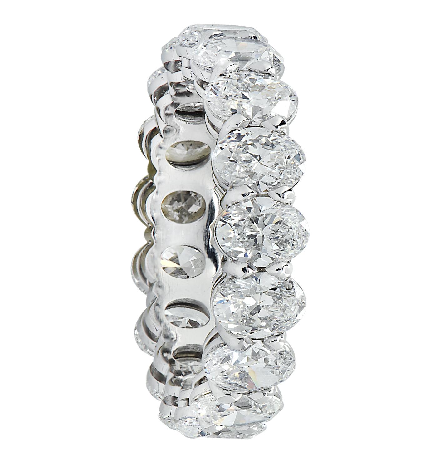 Exquisite Vivid Diamonds eternity band crafted in Platinum, showcasing 17 stunning GIA certified oval diamonds weighing 5.10 carats total, F-G color, VS1-VS2 clarity. Each diamond was carefully selected, perfectly matched and set in a seamless sea