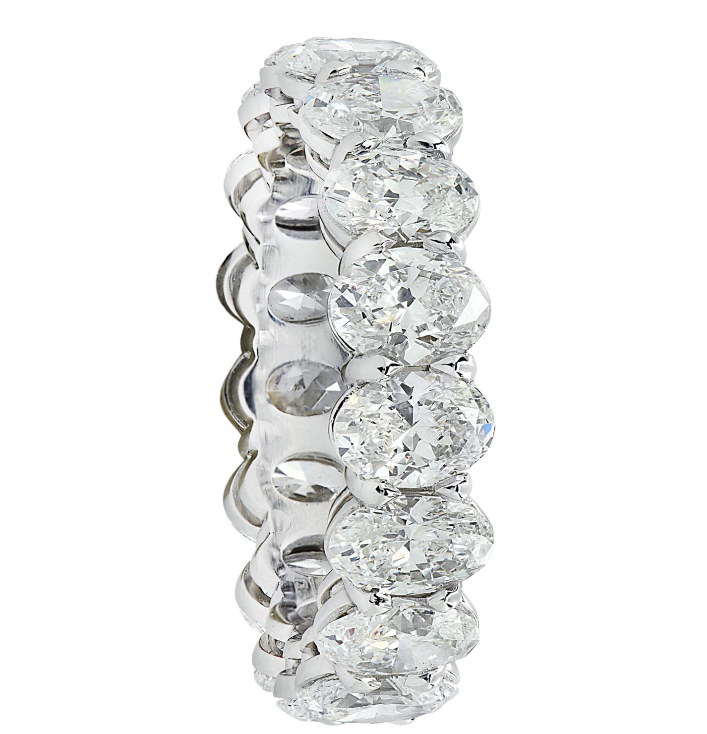 Exquisite Vivid Diamonds eternity band crafted in Platinum, showcasing 17 stunning GIA certified oval diamonds weighing 5.35 carats total, D-E color, VVS-VS clarity. Each diamond was carefully selected, perfectly matched and set in a seamless sea of