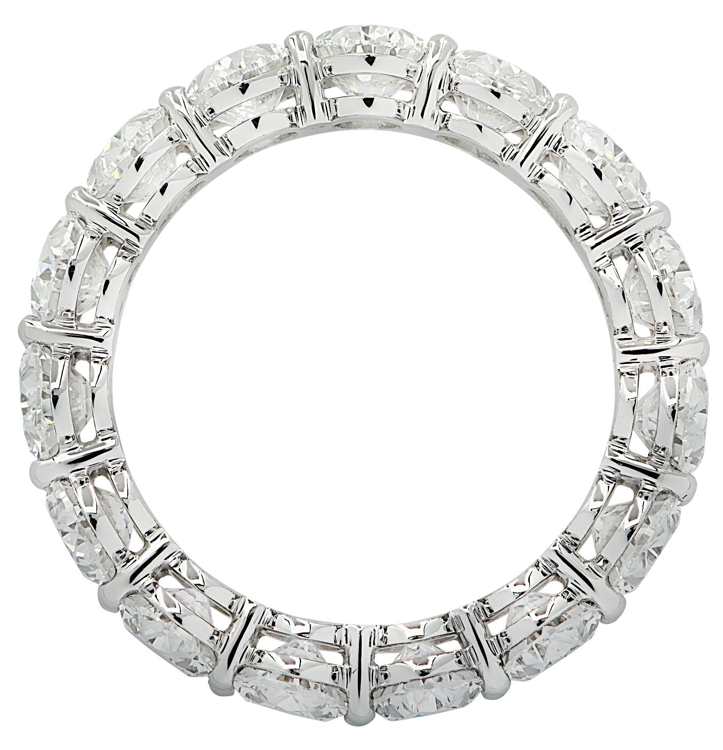 Exquisite Vivid Diamonds eternity band crafted in Platinum, showcasing 14 GIA Certified round brilliant cut diamonds weighing 5.60 carats total, D-F color, VVS-VS clarity. Each diamond was carefully selected, perfectly matched and set in a seamless