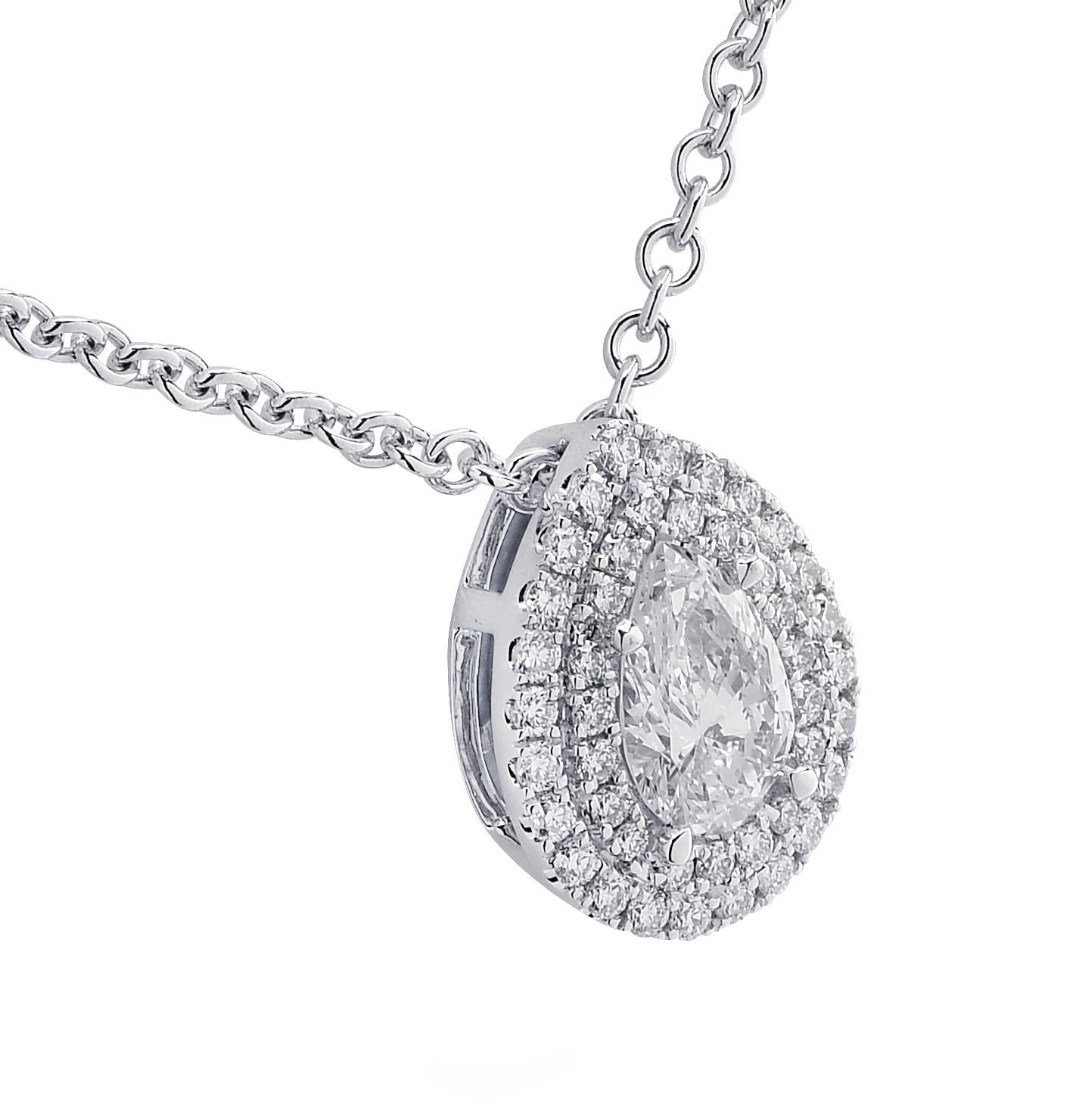 Stunning Vivid Diamonds necklace crafted in 18 karat white gold, showcasing a GIA Certified pear shape diamond weighing 0.59 carats, E color, VS2 clarity, framed with a double halo encrusted with 43 round brilliant cut diamonds weighing 0.26 carats