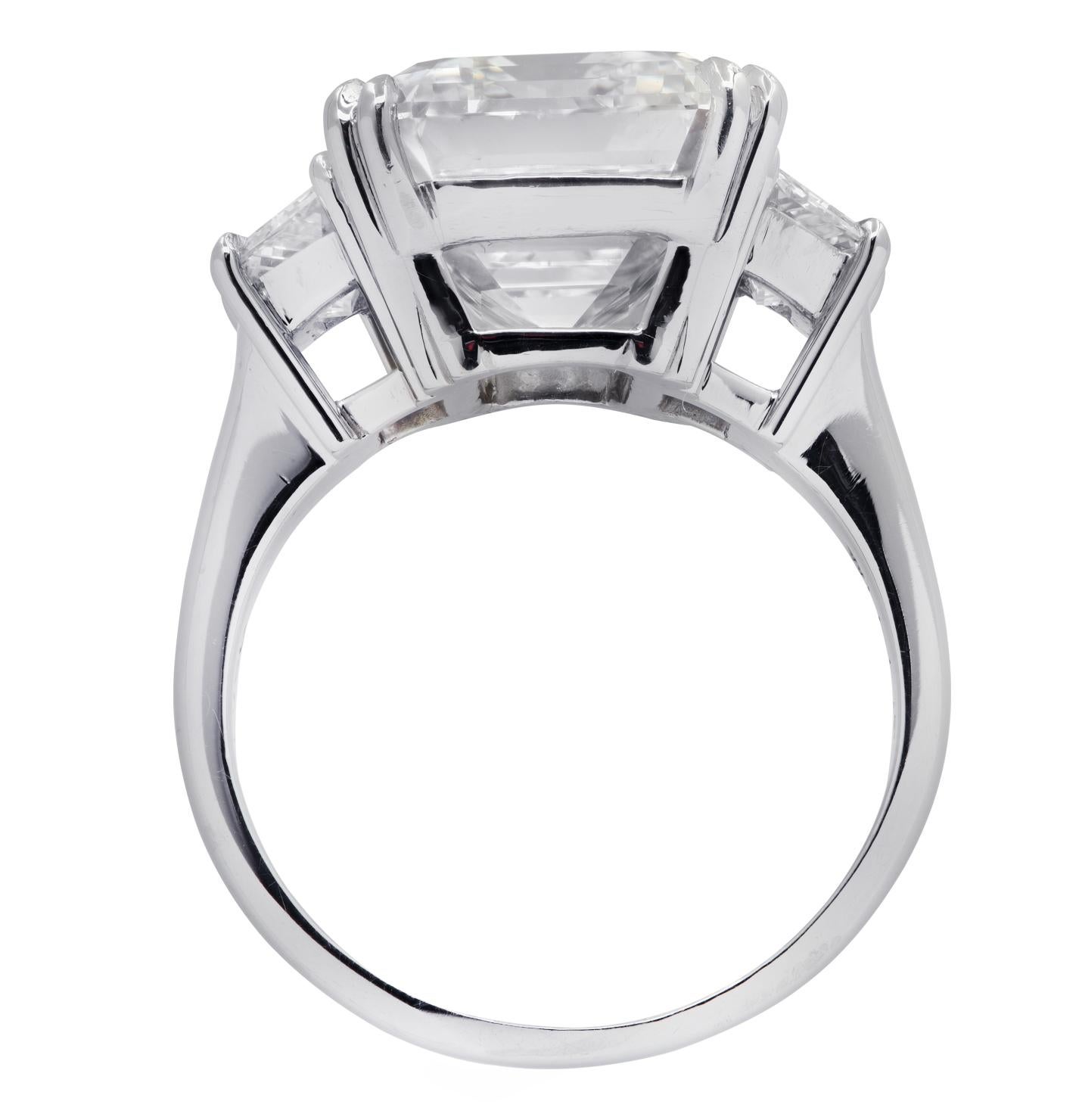 Exquisite Vivid Diamonds engagement ring crafted in platinum, featuring a spectacular GIA certified emerald cut diamond weighing 8.57 carats, H color, VS1 clarity,  adorned with two carefully selected and perfectly matched trapezoid diamonds