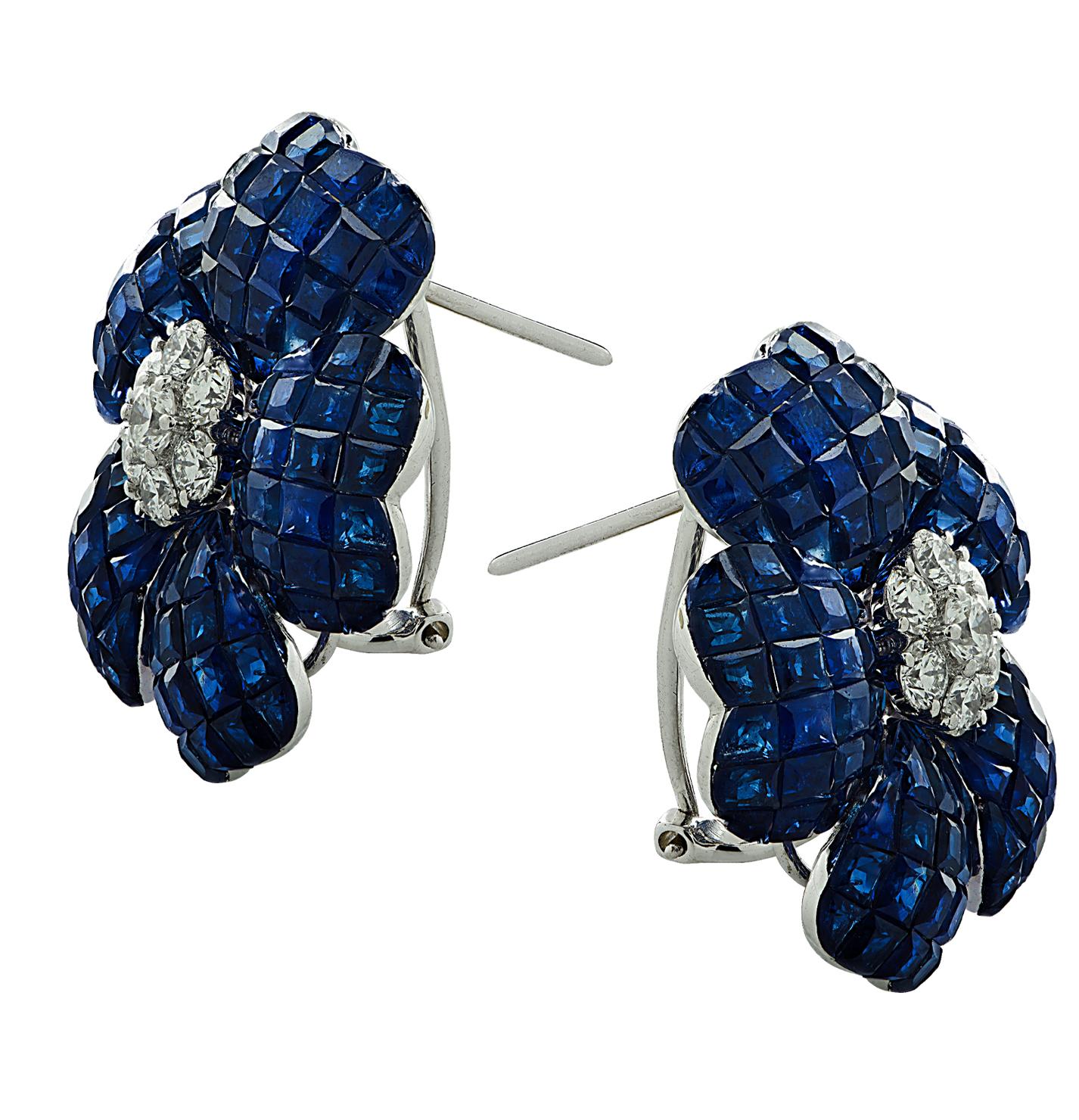 Enchanting Sapphire and Diamond Stud Earrings crafted in 18 karat white gold, featuring square cut Sapphires weighing approximately 37.85 carats total, and round brilliant cut diamonds weigh approximately 1.10 carats total, G color, VS clarity.