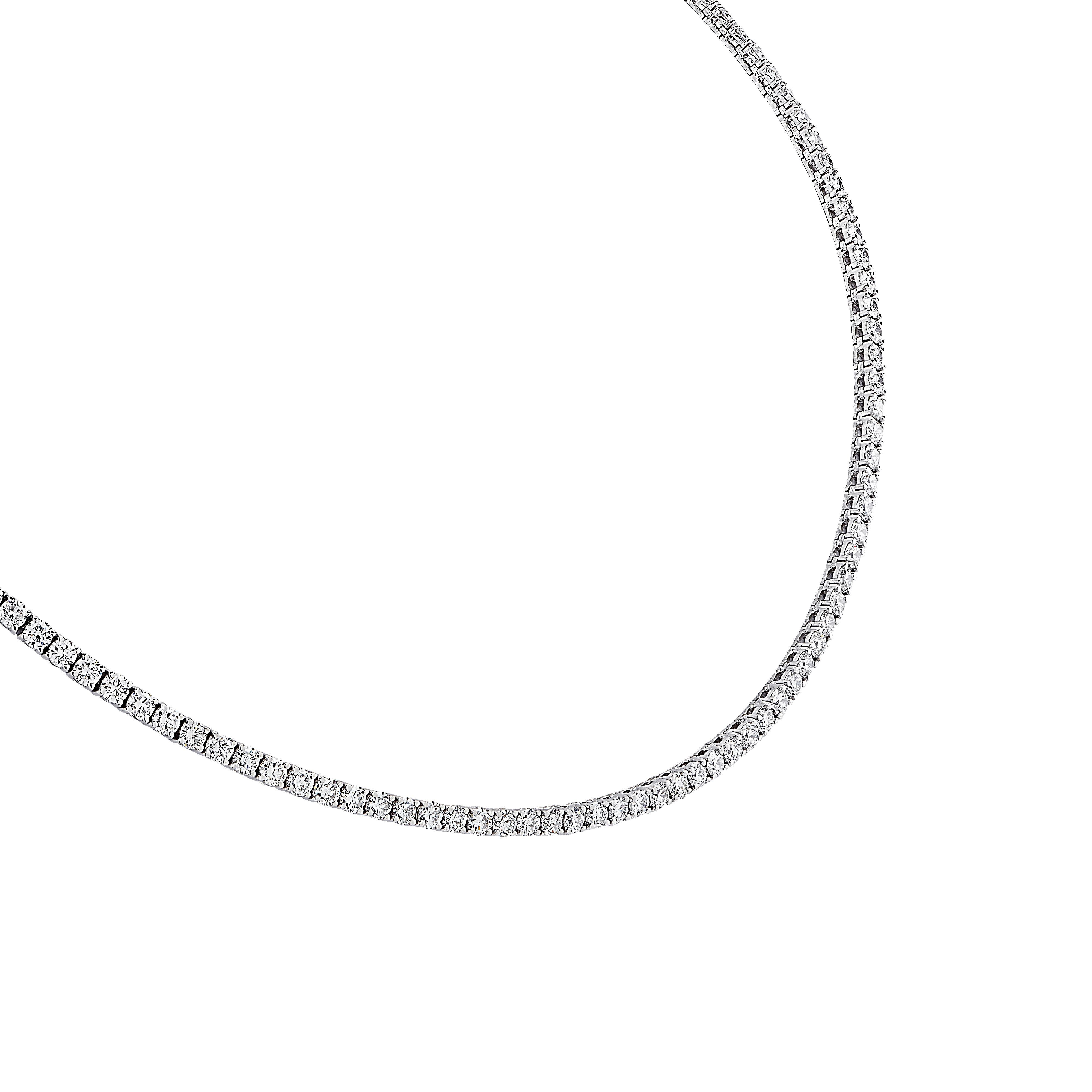 Exquisite Vivid Diamonds Straight Line diamond necklace crafted in 18 karat white gold, showcasing 140 round brilliant cut diamonds weighing 11.47 carats total, F-G color, VS Clarity. The diamonds are set in a seamless sea of eternity, creating a