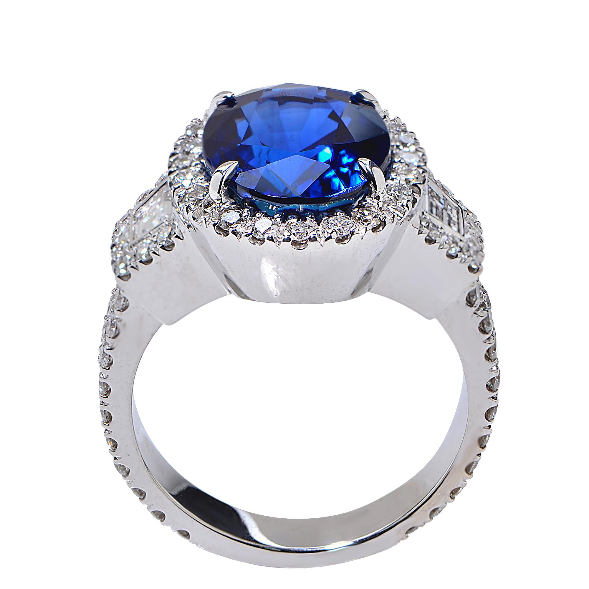 18 Karat White Gold Ring Featuring a 6.22 Carat Natural Blue Sapphire from Madagascar, Heated, AGL Certified, Accented by 1.16 Carats of Trapezoid and Round Brilliant Cut Diamonds, G Color, VS Clarity.

Ring Size: 6
Weight: 11.69 grams

This