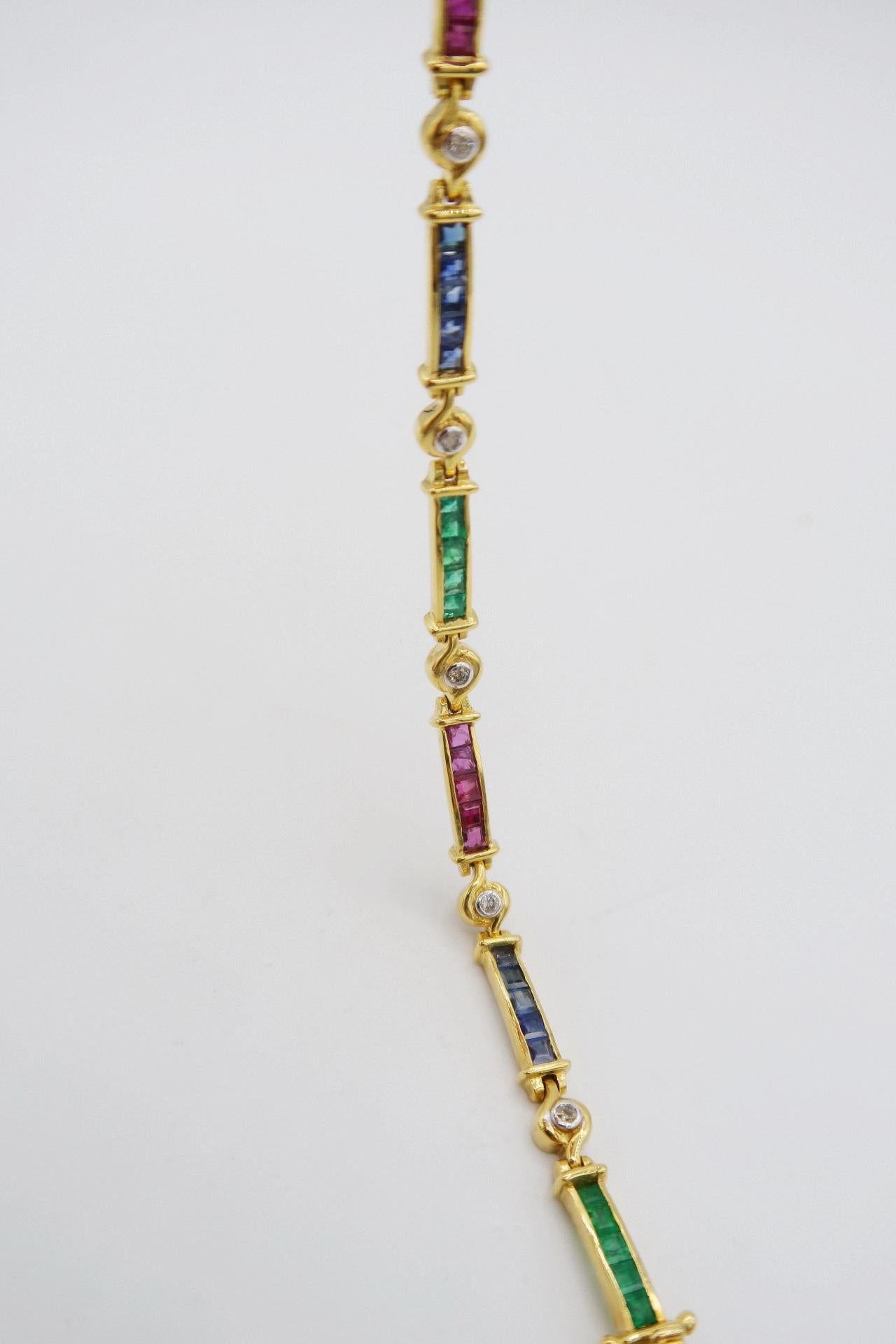 Vivid Emerald Ruby Blue Sapphire Link Bracelet with Diamonds in 18K Yellow Gold

Gold: 18K Yellow Gold, 13.49 g
Emerald: 1.62 ct
Sapphire: 2.30 ct
Ruby: 2.38 ct
Diamond: 0.20 ct

Length: 7 inches