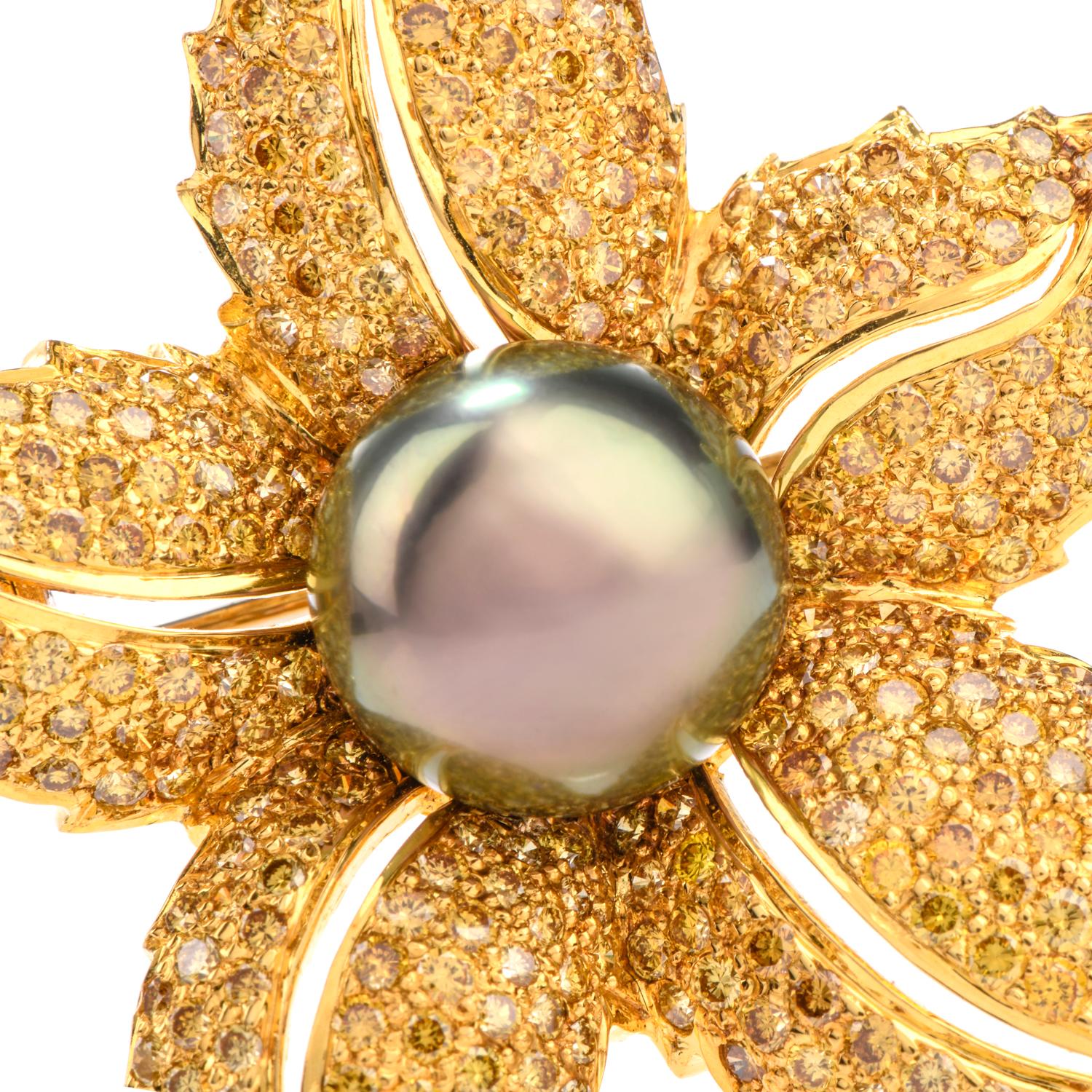 This incredibly bright and glistening brooch was inspired in a

tropical floral motif and crafted in 18K yellow gold.

Measuring appx. 1.5 x 2.0 inch, the brooch is certain

to make a statement.  Featuring one 12mm Tahitian pearl in the center,