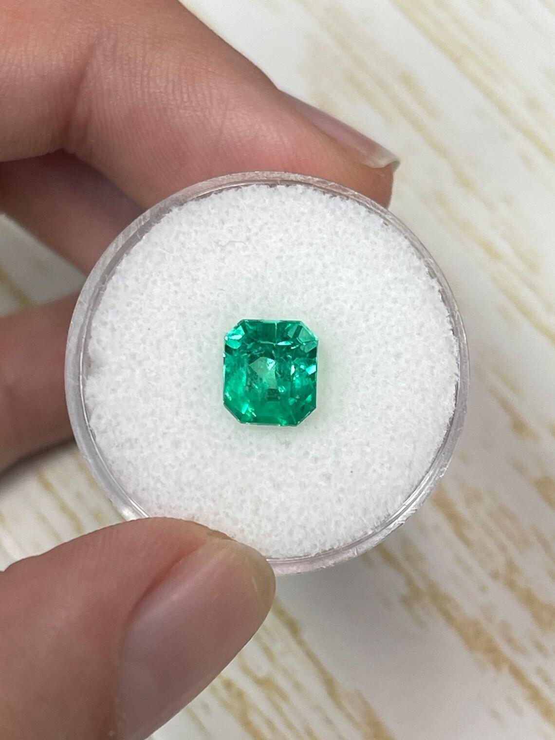 Stone: Emerald
Weight: 1.96-carats
Shape: Emerald Cut
Clarity: Transparent
Luster: Excellent
Color: Vivid Yellowish Green
Measurements: 7.60mm x 6.74mm x 6.10mm
Geographic Origin: Colombia
Treatment: Natural, Oiling

Comments: Due to their growth