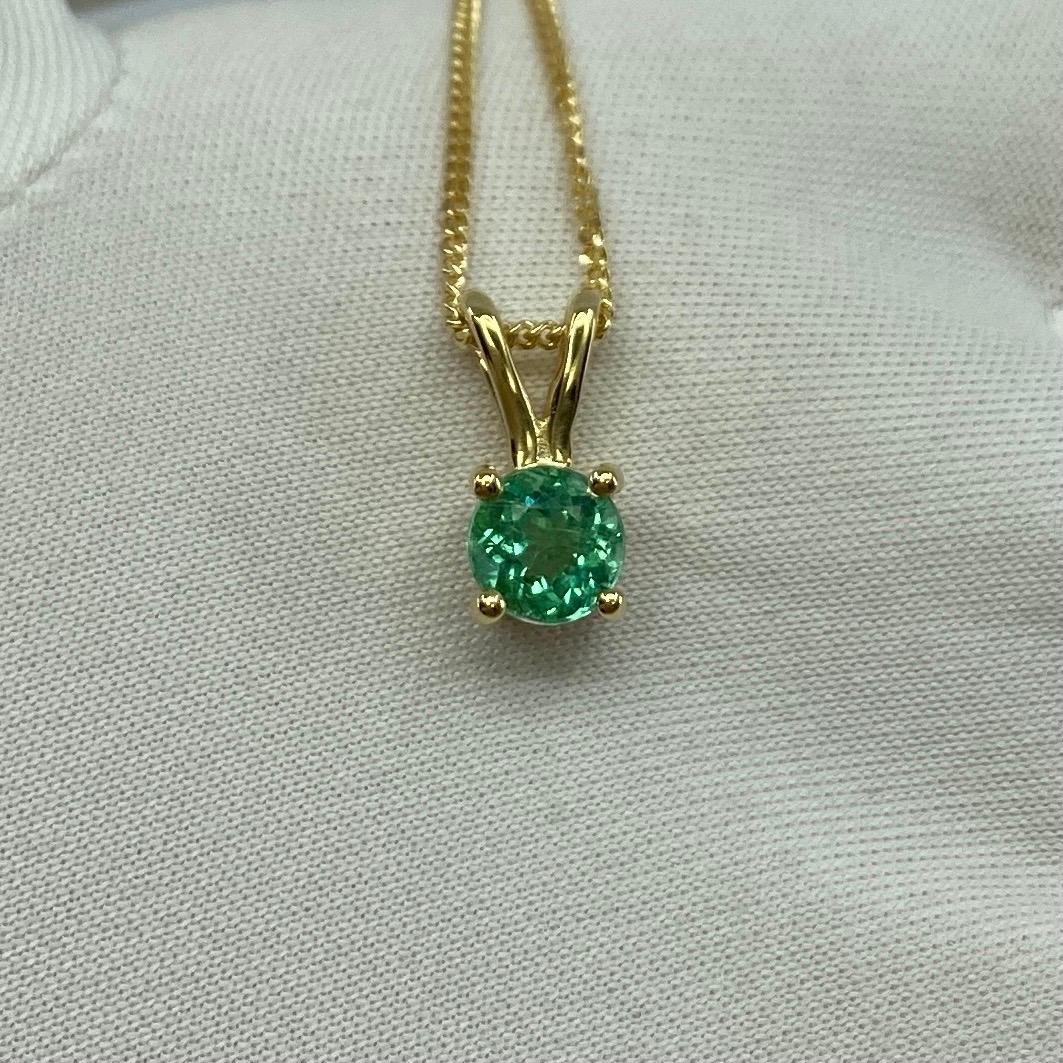 Vivid Green Colombian Emerald 18k Yellow Gold Pendant Necklace.

0.55 Carat emerald with a fine vivid green colour. and excellent clarity, some small natural inclusions visible (as expected with emeralds) but still a clean stone.

The emerald has an