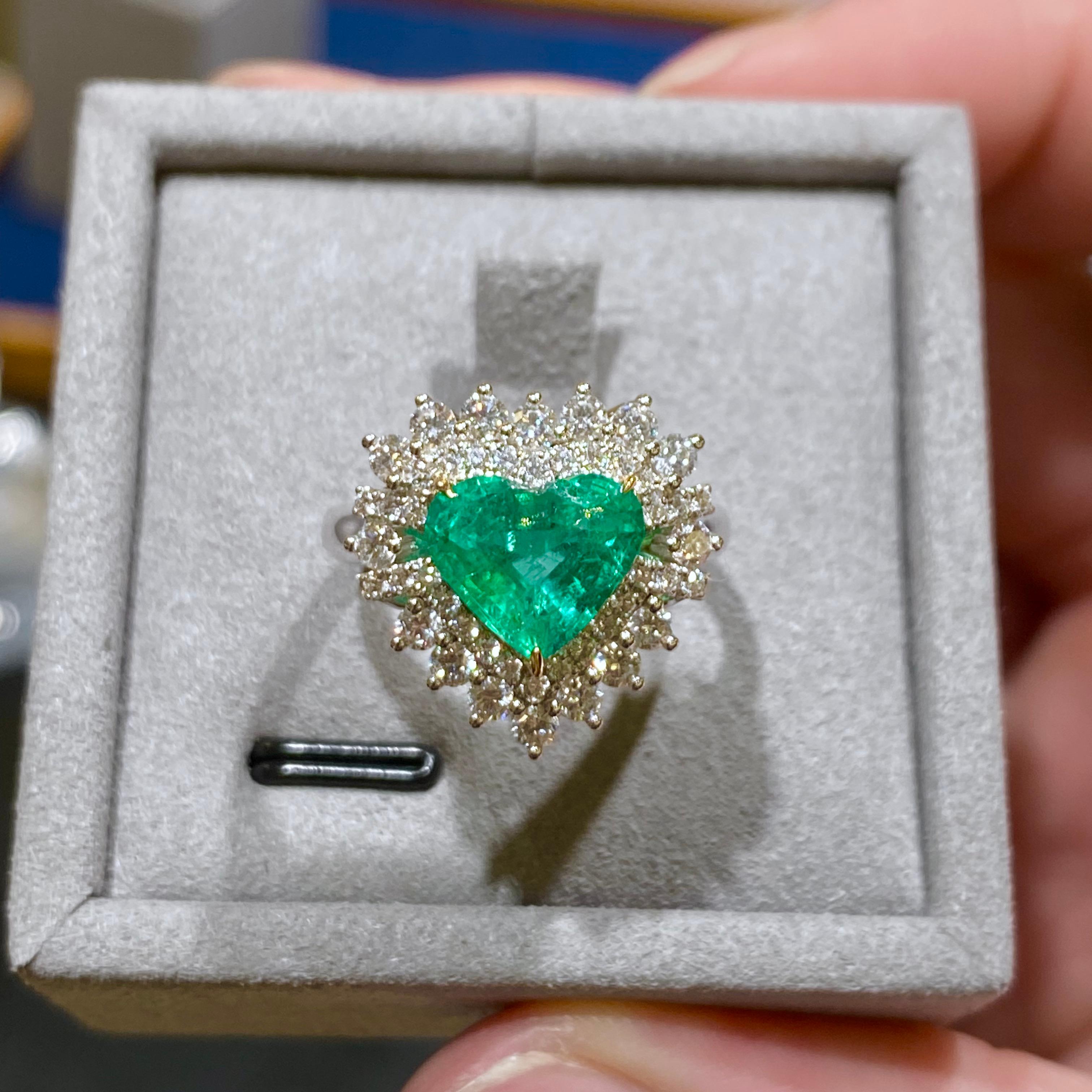 18k gold
Main emerald 1.22ct
Natural diamonds 0.144 ct in vs clarity and E/F colour
Ring is set in 18k white and yellow gold 
total weight is 9.48 gram
