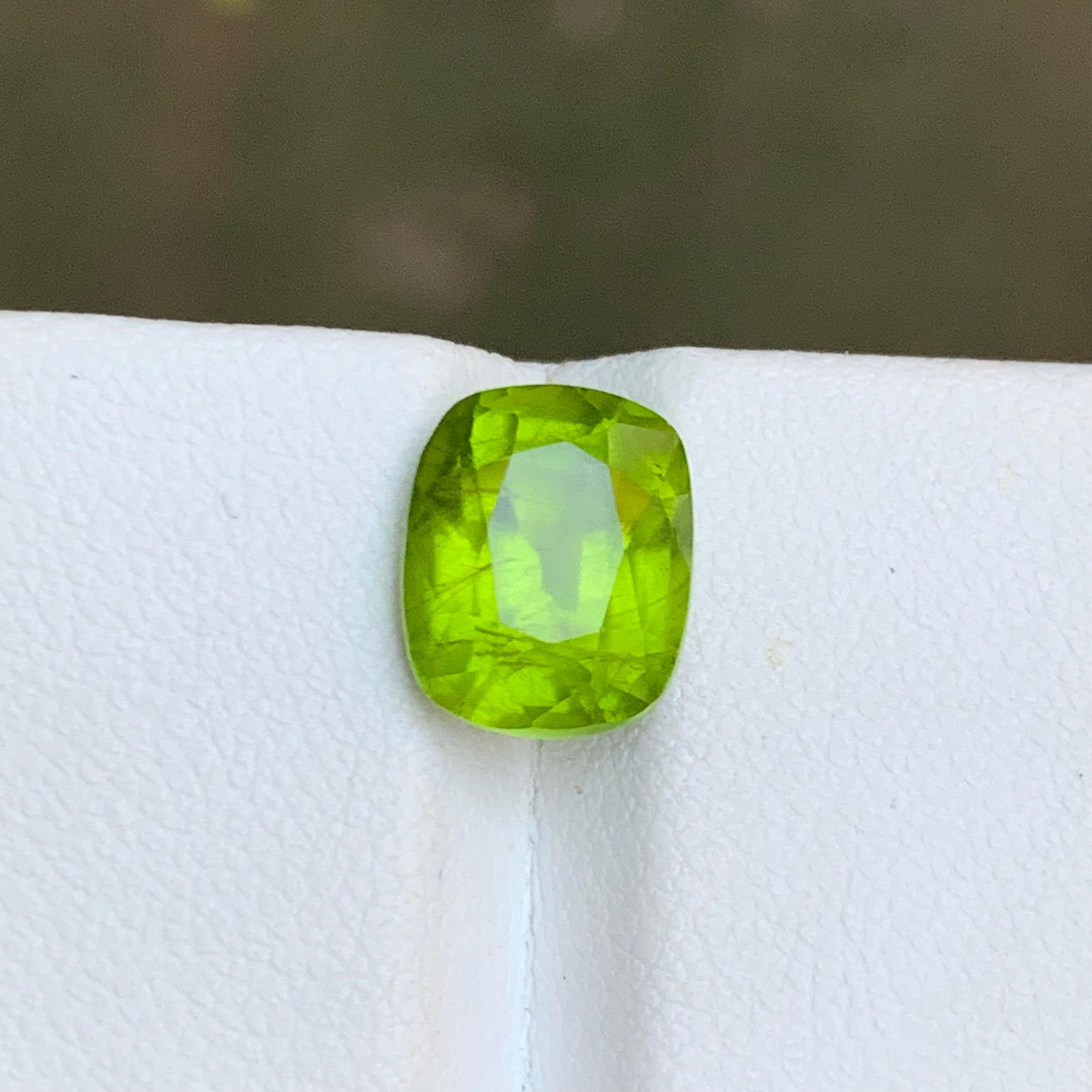GEMSTONE TYPE: Natural Peridot
PIECE(S): 1
WEIGHT: 4.40 Carats
SHAPE & Cut: Cushion Cut
SIZE (MM):  10.25 x 8.41 x 6.94
COLOR: Vivid Green
CLARITY: Slightly Included 
TREATMENT: None
ORIGIN: Supat, Pakistan
CERTIFICATE: On demand
(if you require a