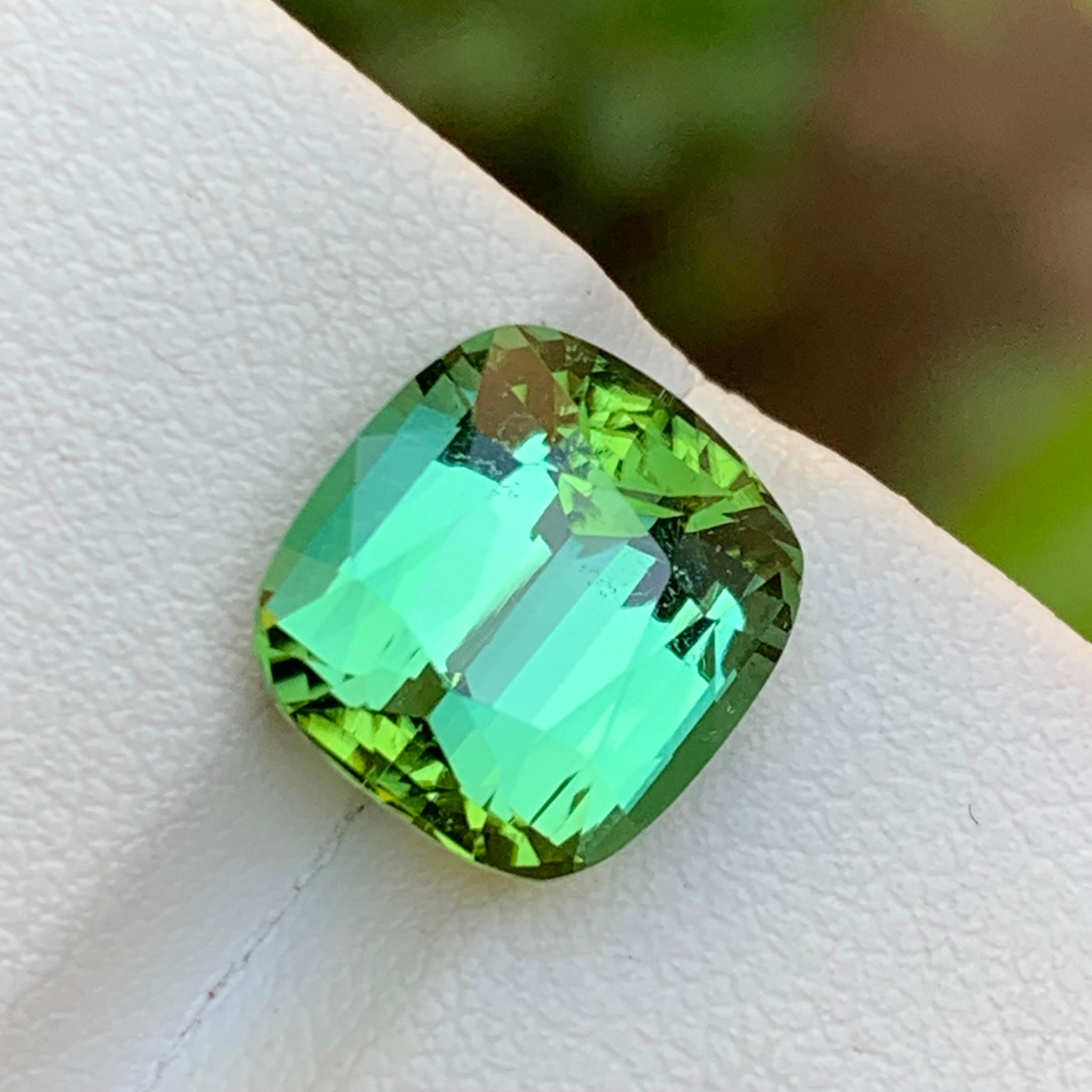 GEMSTONE TYPE: Natural Tourmaline 
PIECE(S): 1
WEIGHT: 5.75 Carats
SHAPE: Cushion Cut
SIZE (MM):  10.67 x 10.15 x 7.25
COLOR: Vivid Green
CLARITY: Approx 90% Eye Clean 
TREATMENT: None
ORIGIN: Afghanistan
CERTIFICATE: On demand
(if you require a